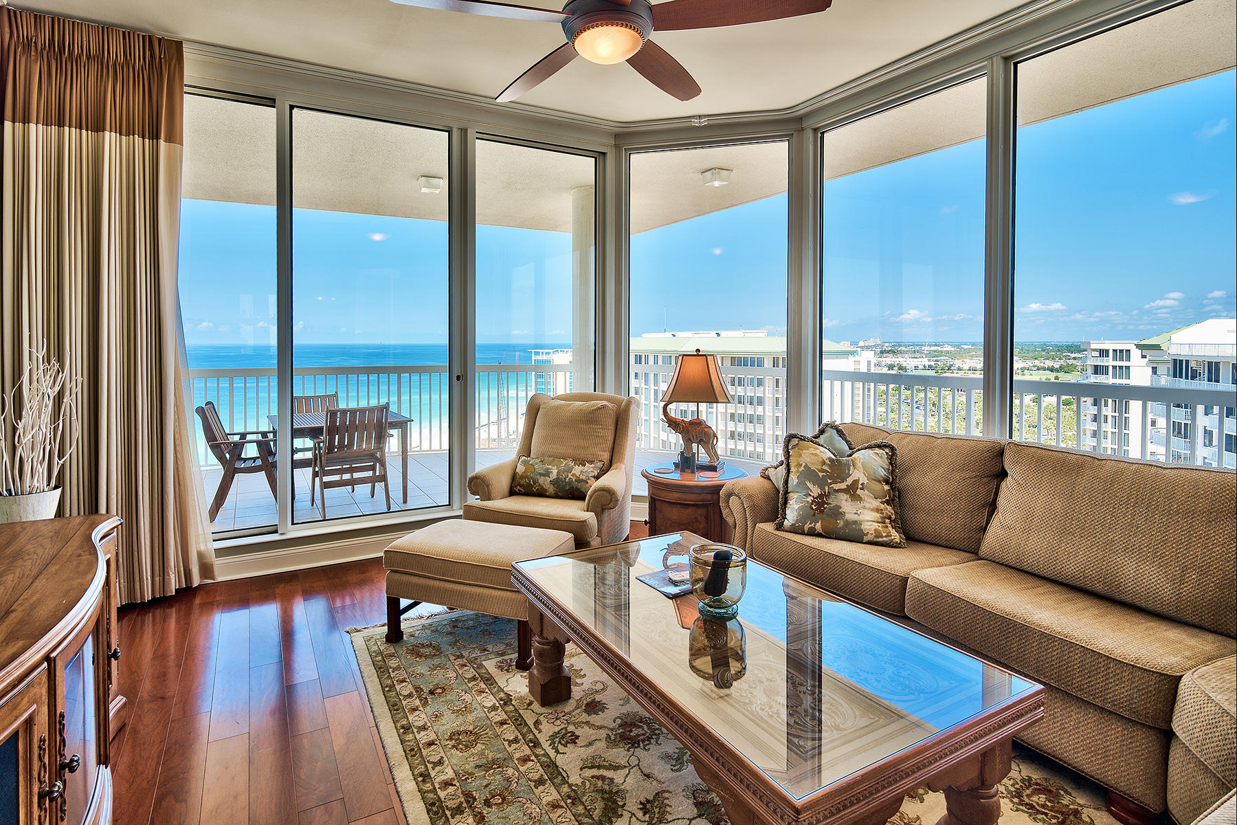 This lofty corner penthouse presides over mesmerizing Gulf and beach views to both east and west as far as the eye can see. Check out the exclusive penthouse video tour! Located within the exclusive St Thomas condominium building, which is non-rental, this 3,200 sq.ft home surrounds you with luxury, starting the moment you step through the double mahogany and glass entrance doors accessed by private elevator. Gleaming wood floors and a feature chandelier create an opulent ambience. The spacious living room and formal dining area enjoy multiple aspects of the beach, pool and stunning Emerald coastline while three bedrooms and 4.5 baths provide ample space for family and guests to share this dream Gulf front residence.