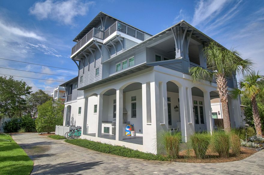 South of 30A and adjacent to Rosemary Beach, enjoy the gulf views from this stunning three story home located in the quiet, gated neighborhood of Pinecrest. Offered fully furnished and ready for your family and guests, step onto the wraparound front porch and enter into a stunning open living room, dining room and kitchen area with natural lighting from the multitude of windows. The incredible living space is highlighted by two beautiful sitting areas and gas fireplace. The gourmet chef's kitchen, is complimented by a full Thermador suite of appliances, hand crafted cabinetry, beautiful Italian marble counter tops and a large island with additional seating adjacent to the dining area. Off the living area is a spacious laundry room that opens onto back porch and half bath