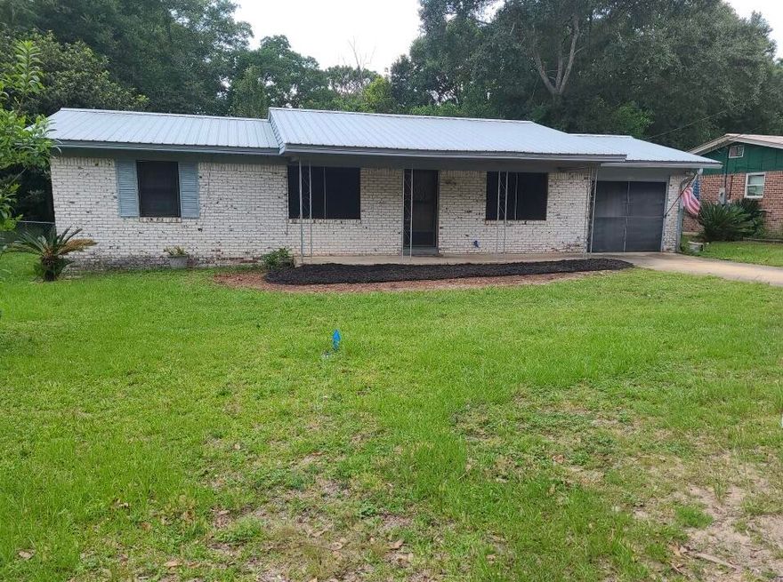 Located in the Crestview Central, this all brick home is just waiting for new owners. Home was built in 1971 and does have aluminum wiring. Home has 3 bedrooms and 2 full baths. The full bath has a recently installed handicapped tub. Home has laminate flooring through most of the home, large eat in kitchen/dining area and large laundry room pantry. Outside you will find metal roof, detached and powered storage/workshop and fenced back yard. Price reflects as is condition and wiring, call today for your showing!