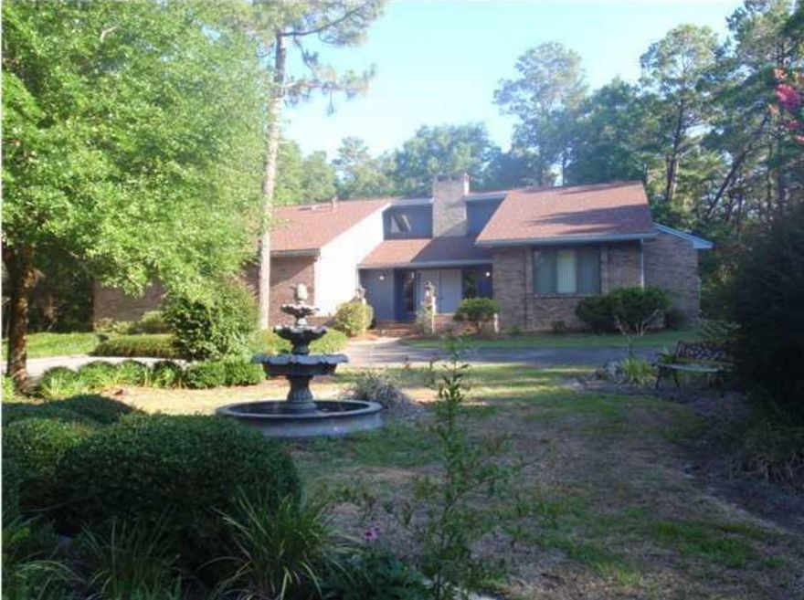 If you are seeking privacy and lots of space, this home is for you! Nearly 1.3 acres in desirable Rocky Bayou. 3 large bedrooms, 2.5 baths with plenty of room to grow. You'll love the huge living room with a vaulted ceiling, large window seat and floor to ceiling brick fireplace. The spacious kitchen was updated in 2010 and there have been many recent upgrades as well. You will find a fabulous Florida room ideal for an office, den, exercise room or music room. A formal dining area, office, and large laundry room round out this incredible home. Plenty of room to add a pool and so much more. Make this home yours today!