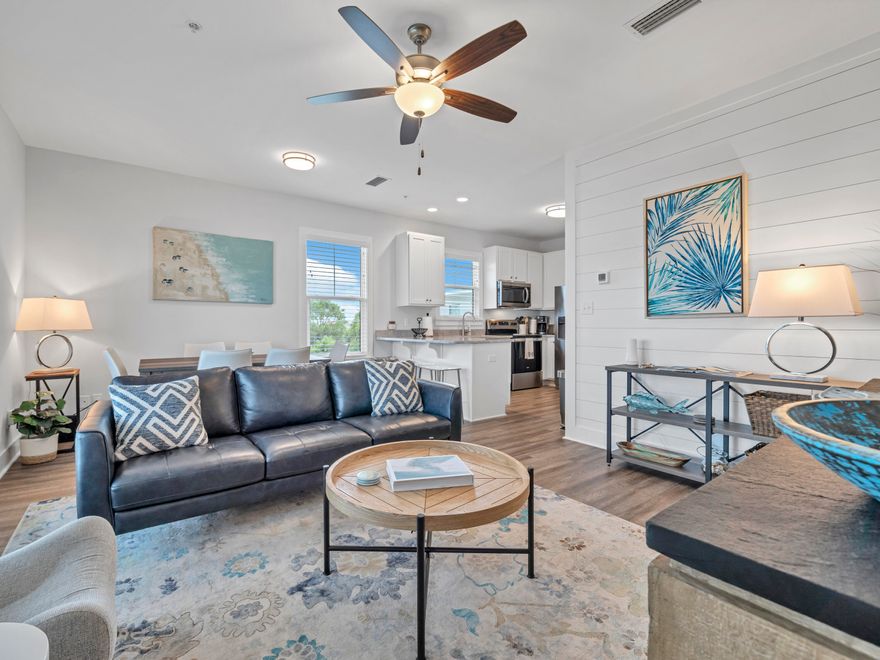 TOP FLOOR MODERN LUXURY WITH VIEWS OF GULF & RENTAL READY!! Enjoy the relaxing beach life on the west end of Scenic Highway 30A in this barely used, top-floor, 3 bed, 2 bath condo at Hidden Lake Condos. Nestled between picturesque Blue Mountain Beach and Gulf Place on 30A, Hidden Lake offers a blend of modern luxury and beachside tranquility. This southern end unit has a peek-a-boo gulf view through the trees and is being sold fully furnished and turnkey for the next owner to enjoy. This upgraded condo features shiplap accent walls, 9 ft. ceilings throughout, modern LVP flooring, and granite countertops in the kitchen and baths, along with high-end coastal chic furnishings. The condo opens to an expansive covered balcony that stretches the length of the unit, perfect for enjoying the serene surroundings. Community amenities include a relaxing zero-entry pool, fully equipped fitness center, and the development is gated for added security. Hidden Lake is positioned within walking distance of two public beach accesses and is centrally located to the many boutique shops and restaurants in Gulf Place and Blue Mountain Beach.