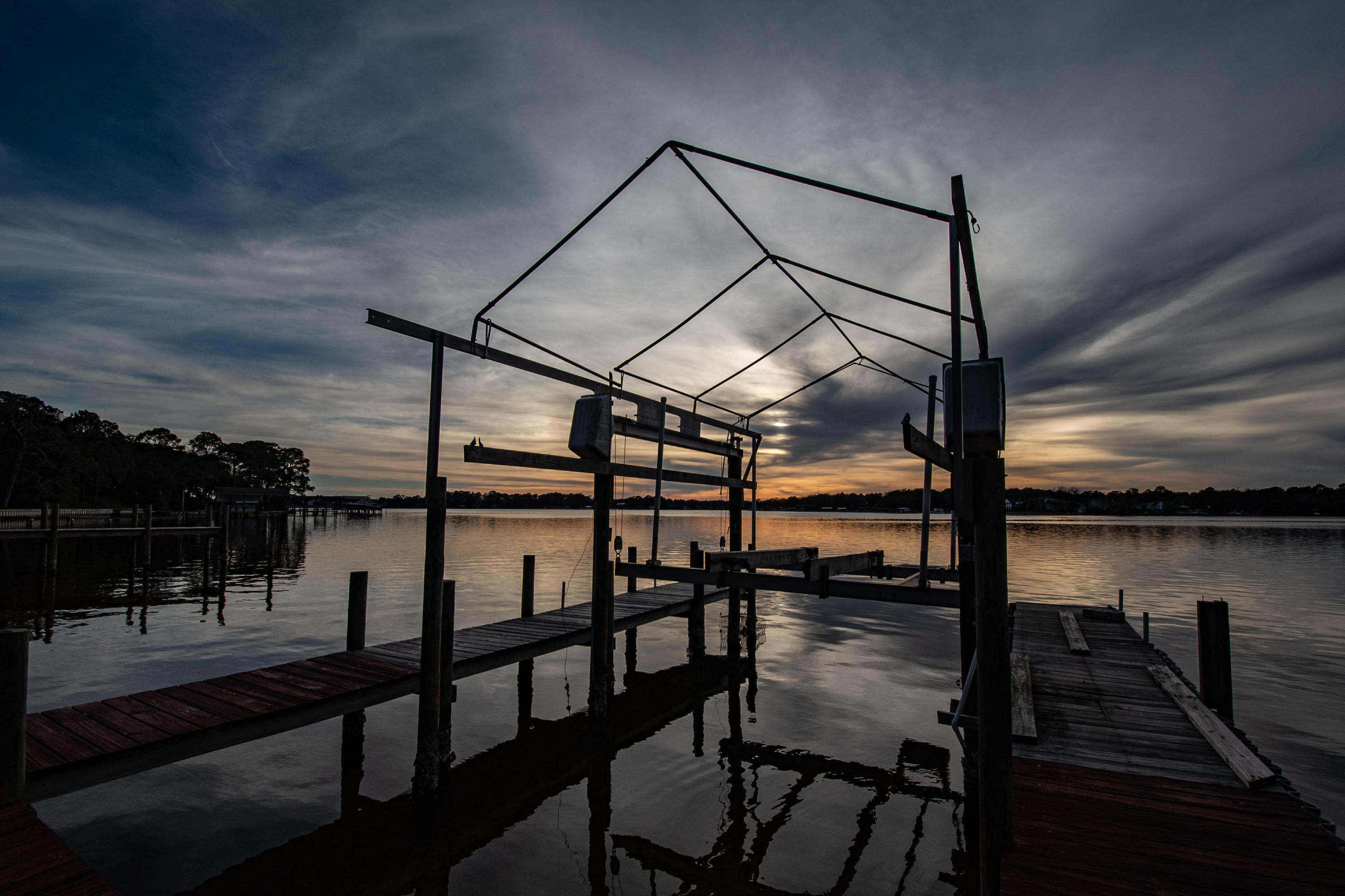 Rare investment renovation opportunity in sought after WATERFRONT community with million dollar view. In Poquito Bayou, the most desirable area in Shalimar. Shalimar is a great location, close to Eglin Air Force Base, this home sits on almost 100 feet of beach. One of the few properties that doesn't have a seawall and has a natural beach. It is over 14' above the water, no flood insurance required. The home needs some work. Protected deep water with a boat lift. Bring us an offer!http://www.heritagehomesfamily.com/office/fl/designs.phpPlease use the link attached to get an idea of some newer homes that would look great.