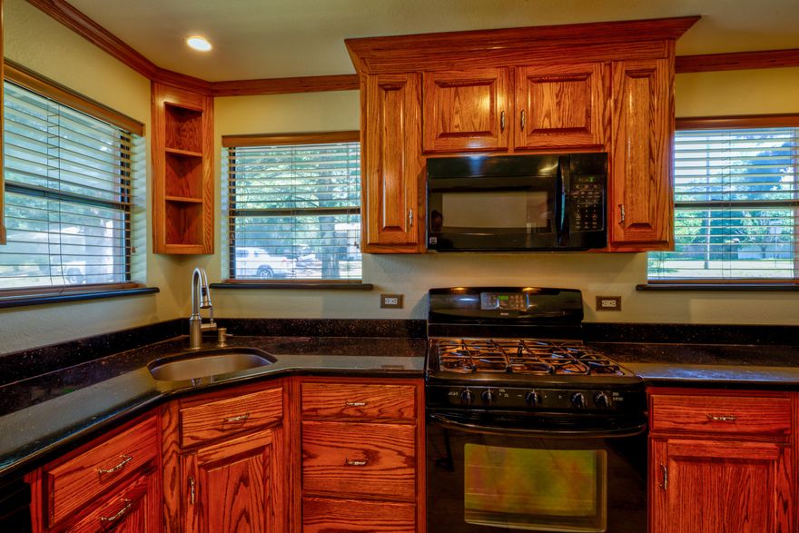 Charming, remodeled home in the heart of Valparaiso, just a few miles from the gate of Eglin Air Force Base. This is a must see and absolutely adorable. Large lot with ample room for your boat, RV, multiple vehicles and other toys with no HOA. Kitchen is remodeled with beautiful quartz counter tops, soft close cabinets and new appliances. Living room has original hard wood flooring with a stunning stone fireplace. Kitchen and bathrooms have ceramic tile floors and most of the other rooms have new flooring. There is a study for reading and relaxing off the main living area, leading into the family room which has a private entrance. All doors have been upgraded. Bathrooms have also been fully remodeled. All plumbing and electrical have been replaced. Tankless Rinnai water heater! Spacious detached carport with room for several cars and tool and an attached workshop.