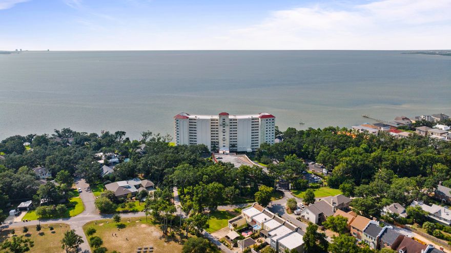 Exceptional unit located at the Riviera. High floor and updated unit with fantastic views of Pensacola Bay. This 2 bedroom, 2 bathroom unit is updated and ready for a new owner. Kitchen includes wine fridge, stainless appliances, tile backsplash and granite countertops with plenty of cabinet storage. Wood look tile floors throughout the entire condo so no carpet to maintain and neutral paint throughout. The master closet has custom-organized shelving and is an oversized walk-in. The guest bedroom has a custom Murphy bed for ease and convenience for when guests sleep over. Each living space (both bedrooms and living room) have their own updated sliding doors to the large oversized balcony that allows you to take in the views of the water, look for dolphin, get a peak at the American Magic sailing vessel and even catch the blue angels flying over the bay throughout the year for their practices and air shows!! Each sliding door has custom roll-down hurricane shutters that have been added for your security during inclement weather. The Riviera is a well-maintained property with 24 hour security and doorman. There is a common area, community pool, meeting/party room with a full kitchen on the 1st floor and so much more for your enjoyment. There is a laundry room on each floor and this unit has a large locked separate storage room located off of the main hallway. Located in a the neighborhood leading into the Pensacola Country Club, right by NAS Pensacola, golf, marinas, beaches and downtown Pensacola. Come and enjoy condo living along the gulf coast with amazing water views! Call today to schedule your private showing.