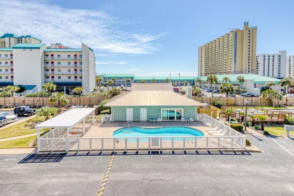 Purchase for only 10% Down! Lowest priced 3 bedroom SOUTH of Highway 98! HURRY to the beach. Welcome to your new Beach Destination! This gorgeously remodeled 3 bedroom 2 bath beach condo sits on the Penthouse Level (Top Floor), has Gulf Views and is one your friends, family and vacationing guests will enjoy for a lifetime. NO CARPET! Expanded tile flooring and crown molding throughout. Fully furnished + the tranquil decor provides the ultimate relaxing beach experience. Master bedroom features a walk-in closet + a private entrance to the western facing, deluxe and private balcony w/ dreamy sunset views! Soak in the sun at the large beautiful community pool, expansive decks, picnic area w/ BBQ grills or take short walk to a private gated beach access to the gorgeous white sand beach! Condo Complex is Approved for 30 year LOCKED interest rate w/ Local Lender! 