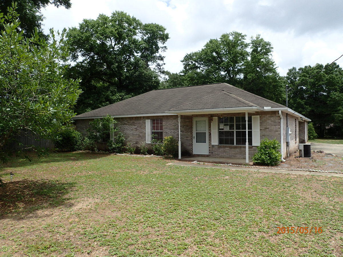This REO property is centrally located just off Hwy 90 West and consists of a mostly fenced back yard, all brick exterior with both an attached covered carport and singe car garage and was built in 1996. This home has 3 bedrooms and 2 baths. Home has wall to wall carpet, vinyl, galley style kitchen and indoor laundry. Priced to appeal to both investors and home owners, this home will not last! Call today for your showing.