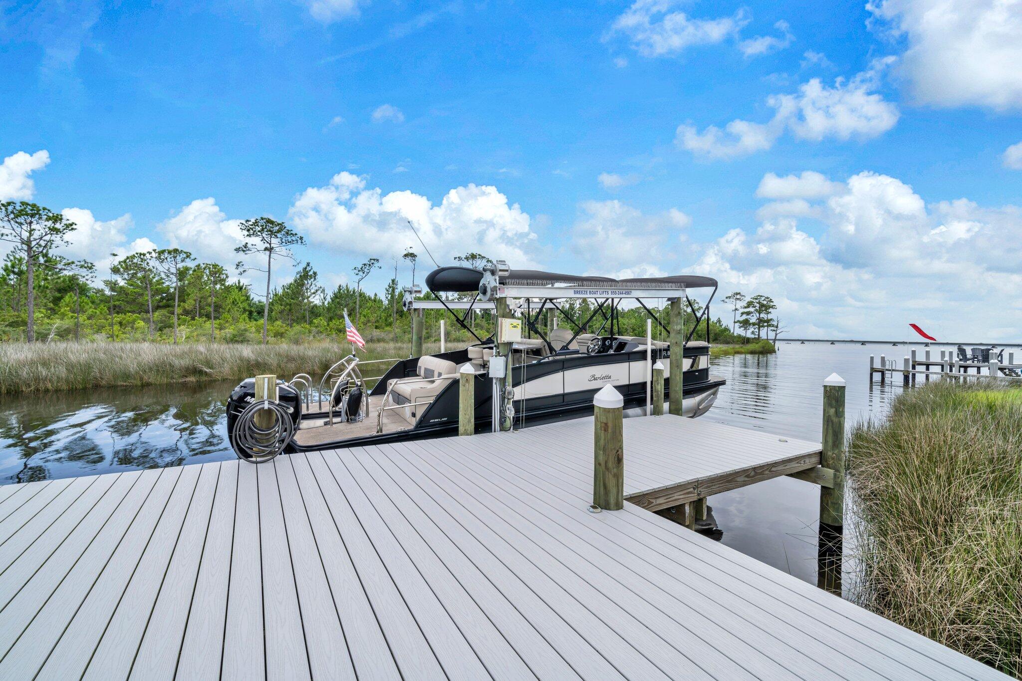 Experience the epitome of coastal elegance at this stunning waterfront estate in the highly sought-after gated community of Regatta Bay. This immaculate residence offers breathtaking views, direct water access, and an unparalleled lifestyle on Florida's Emerald Coast.Boasting 4 bedrooms and 3 bathrooms, this home features an open-concept layout with soaring ceilings, expansive windows, and custom finishes throughout. The gourmet kitchen is equipped with top-of-the-line appliances, granite countertops, and a large island--perfect for entertaining.The spacious master suite offers serene water views, a spa-like bath with a soaking tub, and walk-in closets. Outdoor living with pool is perfect for entertaining.