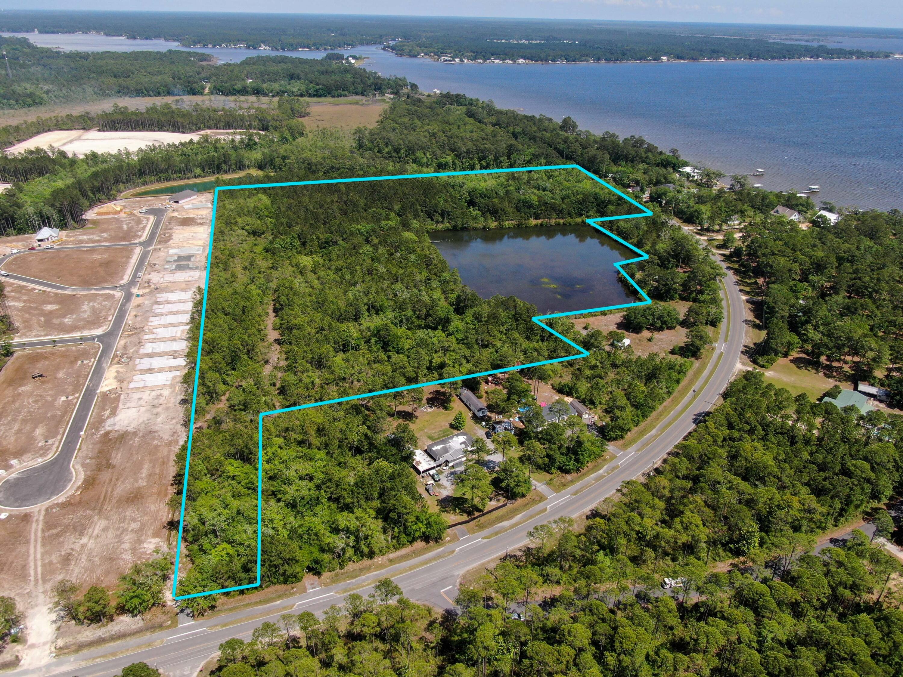 Great property for development, zoned R-1. 26+ Acres. Adjoins Hammock Bay South on Bayloop!