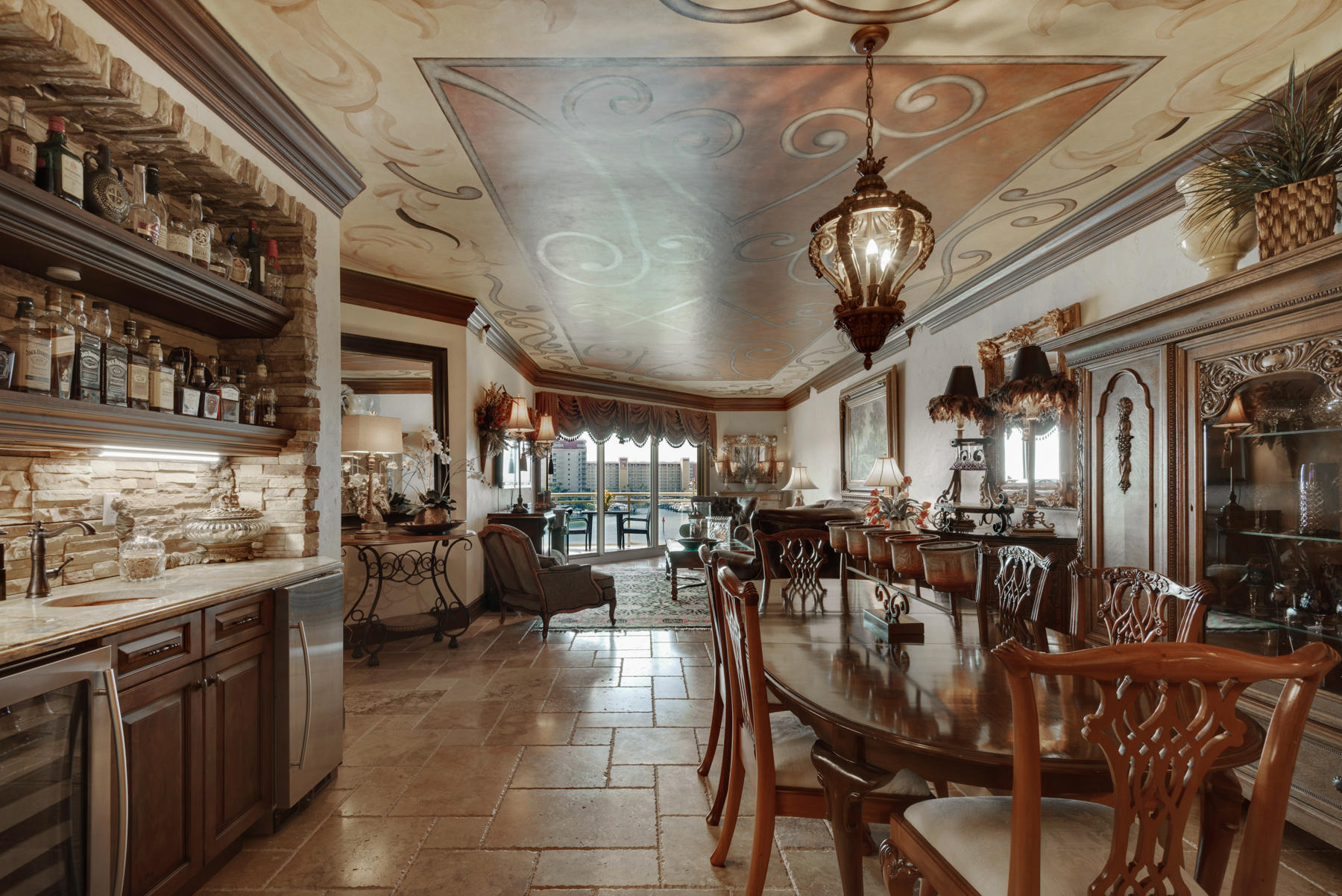 Experience Destin Harbor Living in this beautiful Marbella 3BR/3BA, with media room, Harbor front condominium. The media room may be used as a 4th bedroom. Decorated in a classic Mediterranean design, this unit features beautiful custom finishes including, faux textured walls, ceiling murals and textures, stone, granite, and decorative faux finishes. The unit has solid mahogany doors throughout, granite countertops, and various stone textures. The kitchen hosts large built-in Sub-Zero refrigerator with custom door front paneling, induction cooktop, stove pot filler faucet, mosaic backsplash, faux-brick ceiling, stone vent hood, custom cabinetry, and a unique eat in breakfast bar. Unwind on the spacious balcony and enjoy dazzling sunrises and sunsets over the Destin Harbor.