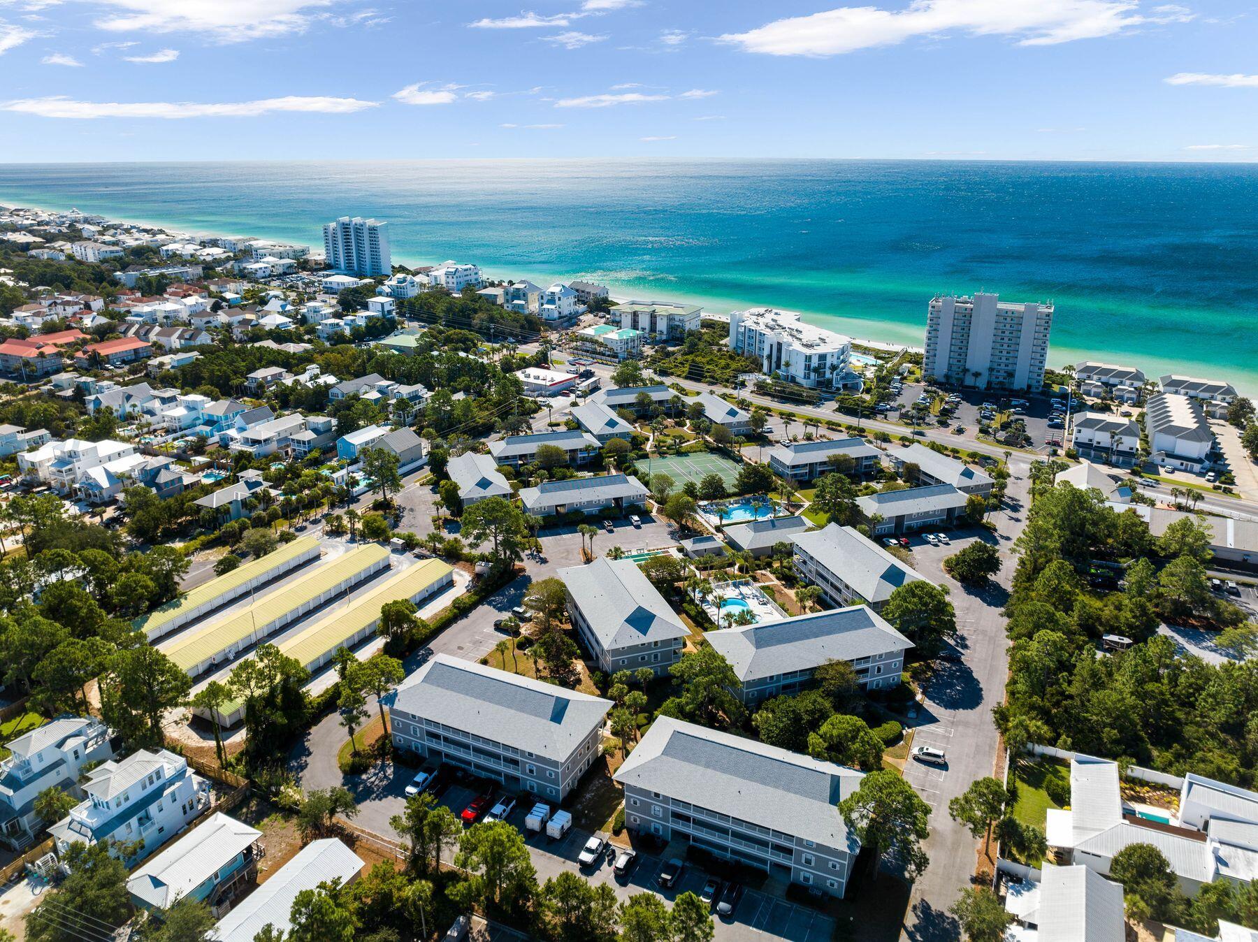 Nestled in the heart of Seagrove Beach along iconic 30A, Beachwood Villas presents a slice of paradise for those seeking the perfect blend of coastal charm and modern comfort. This recently renovated second-floor condo is a turnkey opportunity epitomizing beachside living at its finest. Upon entering this stunning three-bedroom, two-bath retreat, you will be captivated by its fresh, contemporary design. The interior features newly installed LVP flooring throughout, fresh interior paint for a crisp aesthetic and modern ceiling fans for optimal comfort. The fully equipped kitchen boasts new stainless steel appliances, including a whisper-quiet dishwasher and counter-depth refrigerator, complemented by an elegant marble tile backsplash that adds a touch of sophistication. The thoughtful layout comfortably sleeps up to nine guests, making it ideal for family gatherings or a group of friends. The master bedroom features a plush king-sized bed, while a queen bed and a bunk room with twin-over-twin bunks plus a twin trundle provide ample sleeping arrangements for all.

The location of Beachwood Villas is truly unbeatable, situated directly across the street from pristine beach access and just a mere 1.5-mile bike ride to the charming town of Seaside, Florida. You can easily walk to local favorites like Cafe Thirty-A and Dough Sea Dough Donuts. The community itself is a tropical haven, offering two swimming poolsone seasonally heatedlighted tennis courts for day or night play, shuffleboard courts for leisurely entertainment, a dedicated kids' play area, and multiple grilling and picnic spots perfect for outdoor gatherings.

This fully furnished condo presents an excellent opportunity for those looking to enter the 30A real estate market or expand their rental portfolio. Its turnkey status, coupled with recent updates including a new water heater, washer/dryer, sliding glass door and HVAC coil, ensures minimal maintenance and maximum appeal to vacationers. Beachwood Villas combines the best of both worldsa serene, low-rise complex with the vibrant energy of 30A at your doorstep. Whether you're seeking a personal retreat or a lucrative investment, this Seagrove Beach gem offers an unparalleled opportunity to own a piece of the Emerald Coast's most coveted stretch of paradise.