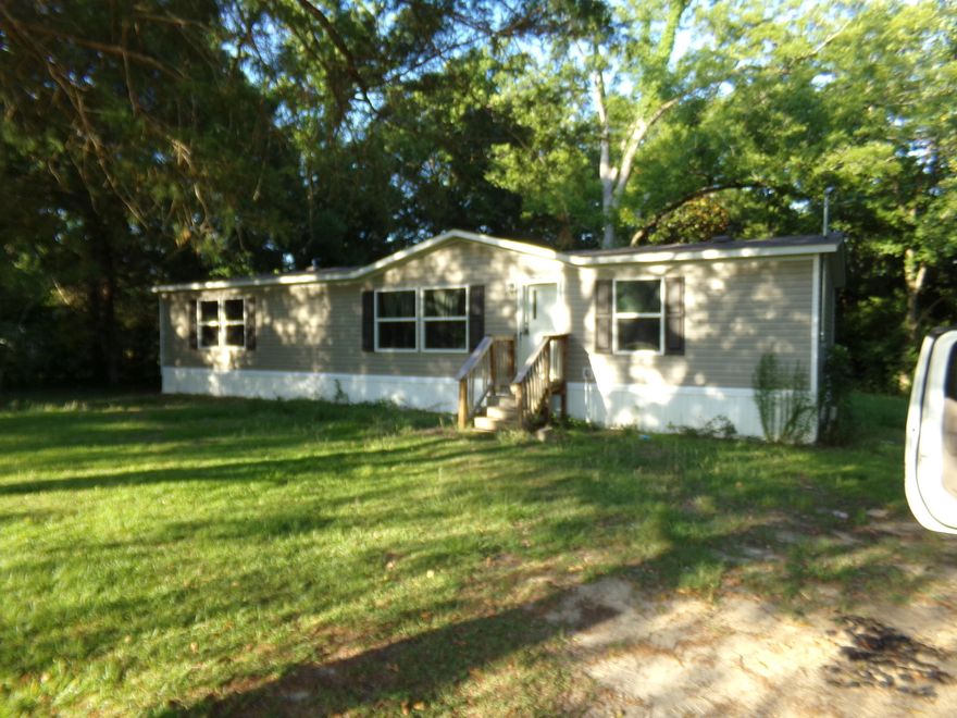 3 bedroom, 2 bath split floor plan with large living room, dining room and large spacious kitchen with island, and lots of cabinets and counter space~  Home sits on .43 acre lot right across from Laurel Hill School~  Home being sold ''AS IS''~