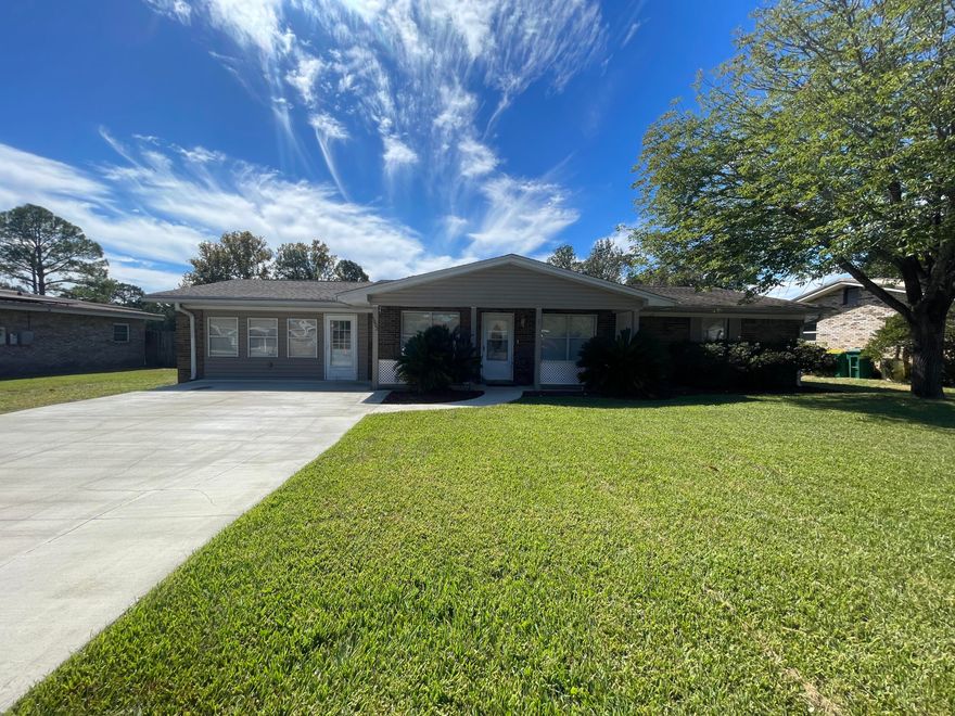Absolutely stunning, totally renovated, 4 bedroom, 3 bath home in the heart of Niceville (easy commute to beaches, bases, schools, shopping, and more). You will love the updates and finishes here, from the spacious, split, open floorplan to the large, privacy-fenced back yard (complete with detached garage fully loaded with power, outlets, lights, roll up door, and side door and an outdoor building, as well as a deck). The living room features neutral paint and flooring, the kitchen is absolutely gorgeous with a huge island/breakfast bar, sparkling counter tops, plenty of cabinet space, and a walk-in pantry. There is a formal dining area with French doors leading to a large Florida room. The primary bedroom is massive and has its own en suite with a dual vanity and walk-in tiled shower.  One of the guest rooms has its own en suite, and the other two guest bedrooms share a third full bath. Pets may be considered on a case-by-case basis with prior owner approval and a non-refundable pet fee. No smoking, including vapes. Must see this one in person!