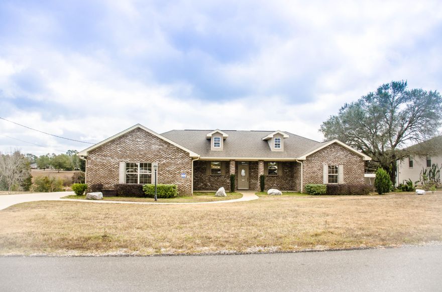 IMMACULATE LAKEFRONT HOME!Imagine walking out your back door and casting out your fishing rod or soaking up the sun on your large deck or screened in porch.This beautiful all brick home boasts many wonderful highlights.An expansive family room is the perfect room for relaxing in front of the corner,natural gas, fireplace or entertaining your friends and family. Neutral tile flooring flows throughout the home while beautiful hardwood flooring compliments the master bedroom and carpeting in additional bedrooms.A great feature for your piece of mind is a 30''x82''safe room added to the master bedroom.The master bathroom has double vanities,an oversized,jetted tub,separate tiled shower,walk-in closet,and water closet.Kitchen is well appointed with Stainless Steel appliances and built- in desk