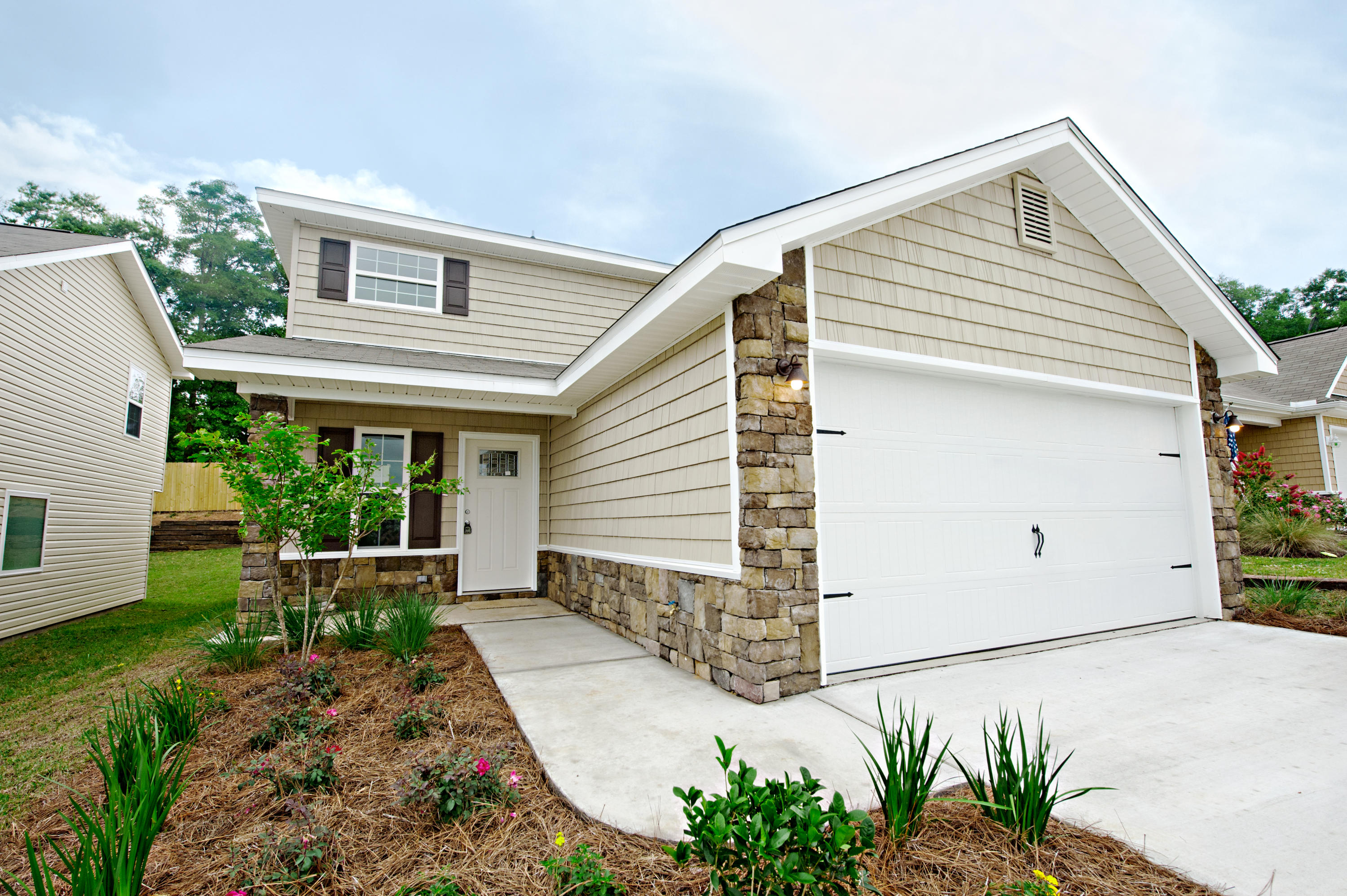 New New New in Award Winning Subdivision. This 4br, 2.5 bath, cottage style two story home has a wonderful plan that offers living, dining room, kitchen with side by side refrigerator, breakfast bar, pantry, smooth top stove and built in microwave. All appliances are stainless steel. Upstairs media room and two car garage. Down stairs Master suite with dual vanities, walk in closet, shower/tub combo with glass enclosure. Half bath downstairs for your guests. This floor plan lives larger than its actual square footage and is a must see. White faux wood blinds throughout. Exterior with stone accent bottom wall and column. Vinyl siding with decorative cedar shakes. Call today for your appointment to view. Builder pays $2400 of buyers closing costs with the use of preferred lender.