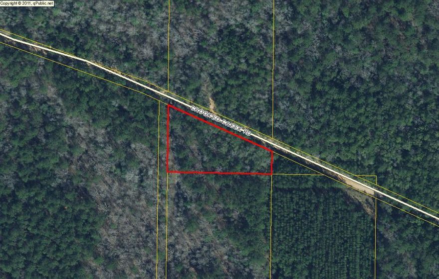 1.64 wooded acres of land. Property would make a great building site for new home or mobile home. Unimproved vacant land. Survey Attached
