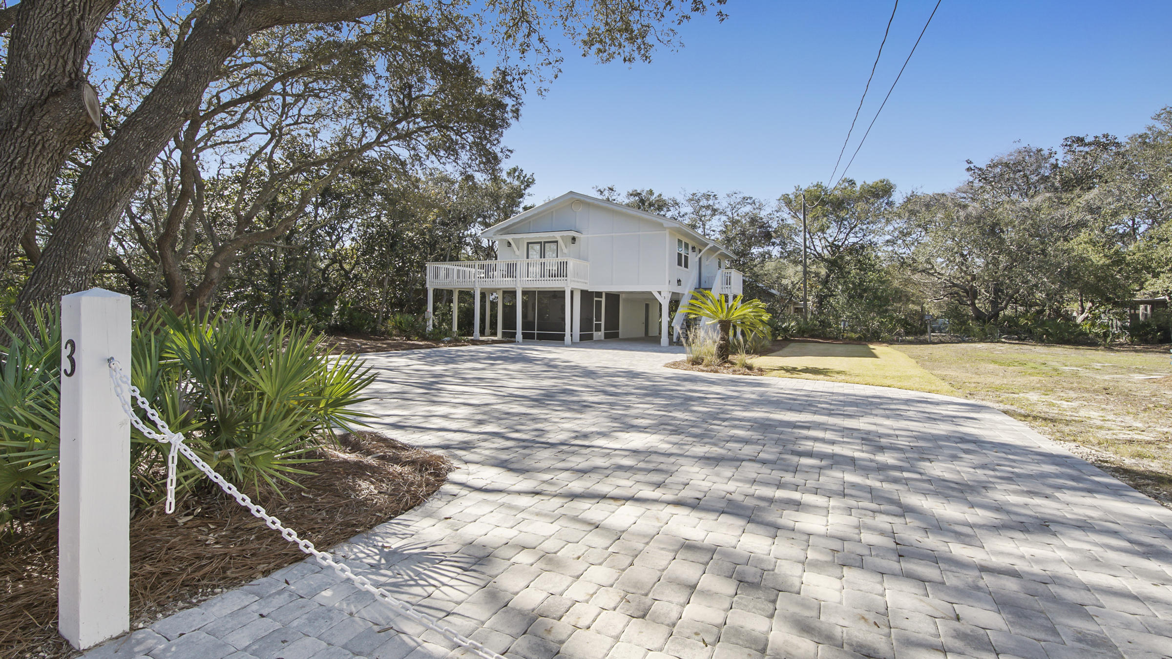 Beautiful newly remodeled home south of 30A with a large screened-in porch downstairs, which includes a sitting area and a custom bar. It sleeps 6, with the sleeper sofa, has hurricane rated windows and doors, and laminate vinyl plank flooring.  The incredible lot is actually 1 A1/2 lots. If you wanted to build you would have possible beach and lake views with the right plan. No HOA dues or buildout time and just 400 feet, short walk, to the beach and lake access. Eastern Lake (a rare coastal dune lake) and a 14,000 acre state forest are just a few of the rare amenities to enjoy in this area. Highway 30-A's shops, restaurants, and bike paths are also just right off of Dalton Drive. This is a rare find with so many possibilities!