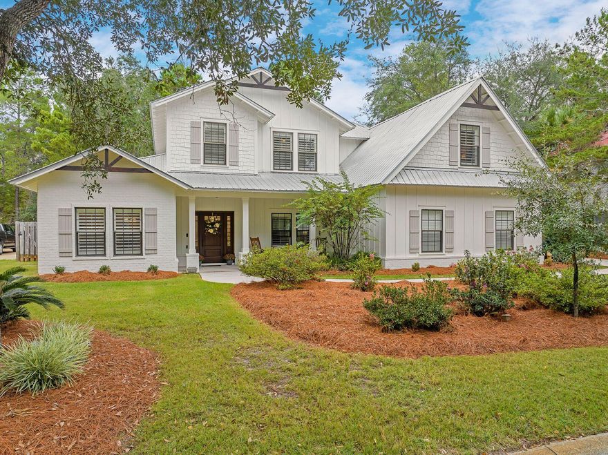 Step inside this recently renovated Botany Bayou home and be welcomed by a dramatic two-story foyer with soaring 20-foot ceilings, an open staircase, and a light-filled living area accented by a striking brick feature wall. The open floor plan is designed for gathering, with the upstairs hallway overlooking the main living space to create a warm and connected feel. A bright formal dining room fills with natural light and provides the perfect setting for family dinners or entertaining guests.The living room opens seamlessly to a large kitchen--the true heart of the home--with a breakfast bar, center island, abundant cabinetry, and a generous walk-in pantry, creating both warmth and functionality for everyday living. The large primary suite on the main level is a private retreat with a newly renovated bath featuring dual vanities, a soaking tub, and a separate shower. Also on the first floor, a second bedroom with its own updated en-suite bath provides comfort and privacy for family or guests. 

Upstairs you'll find two additional bedrooms, a renovated bath, and a versatile bonus room with a floor-to-ceiling built-in entertainment center  an ideal space for movie nights, a game room, or a quiet office. Outdoor living shines with a screened porch for breezy afternoons, a fenced backyard backing up to state forest offering plenty of privacy, and a brick-paver firepit  the perfect spot for cozy evenings under the stars. 

Set within Botany Bayou, a gated bayou-front community, residents enjoy a neighborhood pool and a community dock where mornings can begin with paddleboarding and evenings end with sunsets on the water. Just minutes from Grand Boulevard, the beach, shopping, and dining  and centrally located near top schools and the hospital  this home blends comfort, convenience, and the relaxed beauty of bayou-front living.