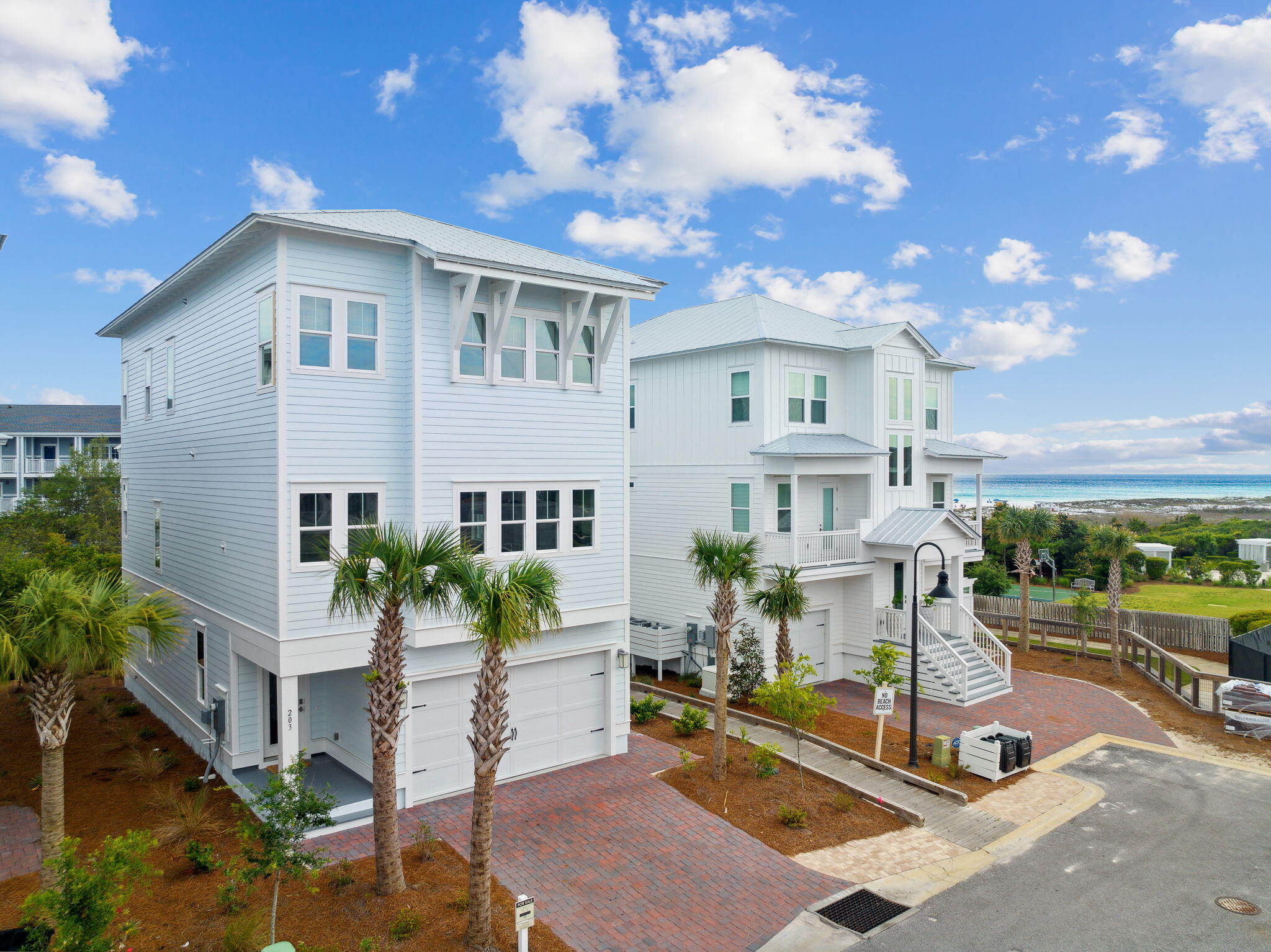 Welcome to 203 Siasconset Ln, a stunning brand new three-story beach home located in Prominence along Scenic 30A between WaterColor and Alys Beach, just steps away from the WaterSound Beach access gate. This turnkey vacation house features luxury finishes and professionally decorated furnishings with crisp white interiors. The 'Bora Bora' floor plan includes 4 bedrooms, 3.5 bathrooms, 3,550 SqFt of living space, an elevator, and decks/patios with amazing gulf views. Other features include hardwood floors, 10 ft ceilings, crown molding, shiplap accents, and a bunk room. The sleek chef's kitchen includes stainless steel appliances and expansive cabinetry. Seller to offer up to $50,000 credit for WaterSound Beach Club membership.  This is a must see if you are interested in WaterSound Beach