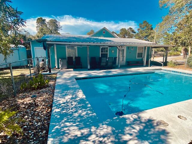 Your own personal pool and privacy in growing Inlet beach. One Level, No Stairs in this 4 Bedroom 2 Bath Home. Situated on the back of the lot, it may offer the option to add an additional structure.Enjoy the mature Palm trees as you enter the circular drive. Here you are within close proximity of desirable 30A & Rosemary Beach to quickly enjoy the ambiance of the Beautiful Crystal Beach & the town without fighting the crowd. New Sidewalks along Orange Street makes it simple to walk, bike or cart to 30Avenues shops & Restaurants. Centrally located between Destin and Panama City Beach to enjoy quick access. With the size of the lot at.40, there is parking and storage galore.This expansive space is a huge plus if your moving here Full time or purchasing as an investment for rental.