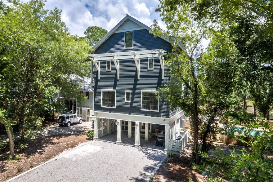 A truly rare opportunity, this waterfront luxury property offers an incredible combination of water access, craftsmanship and privacy nestled within coveted Grayton Beach, consistently ranked among the nation's best beaches. Designed by Geoff Chick and built in 2018, this 5BR/4.5 BA home rests on almost 3/4 of an acre along an ancillary of Western Lake with a private dock, a large pool with sun deck, a volleyball court, fire pit, grill area, a paddle board/kayak launch and a large screened porch with an outdoor seating area. The beach and Gulf are a quick paddle or small craft ride away via the lake, one of South Walton's rare and beautiful coastal dune lakes. Designed for effortless entertaining, indoor and outdoor spaces blend seamlessly and are complemented by custom finishes such as