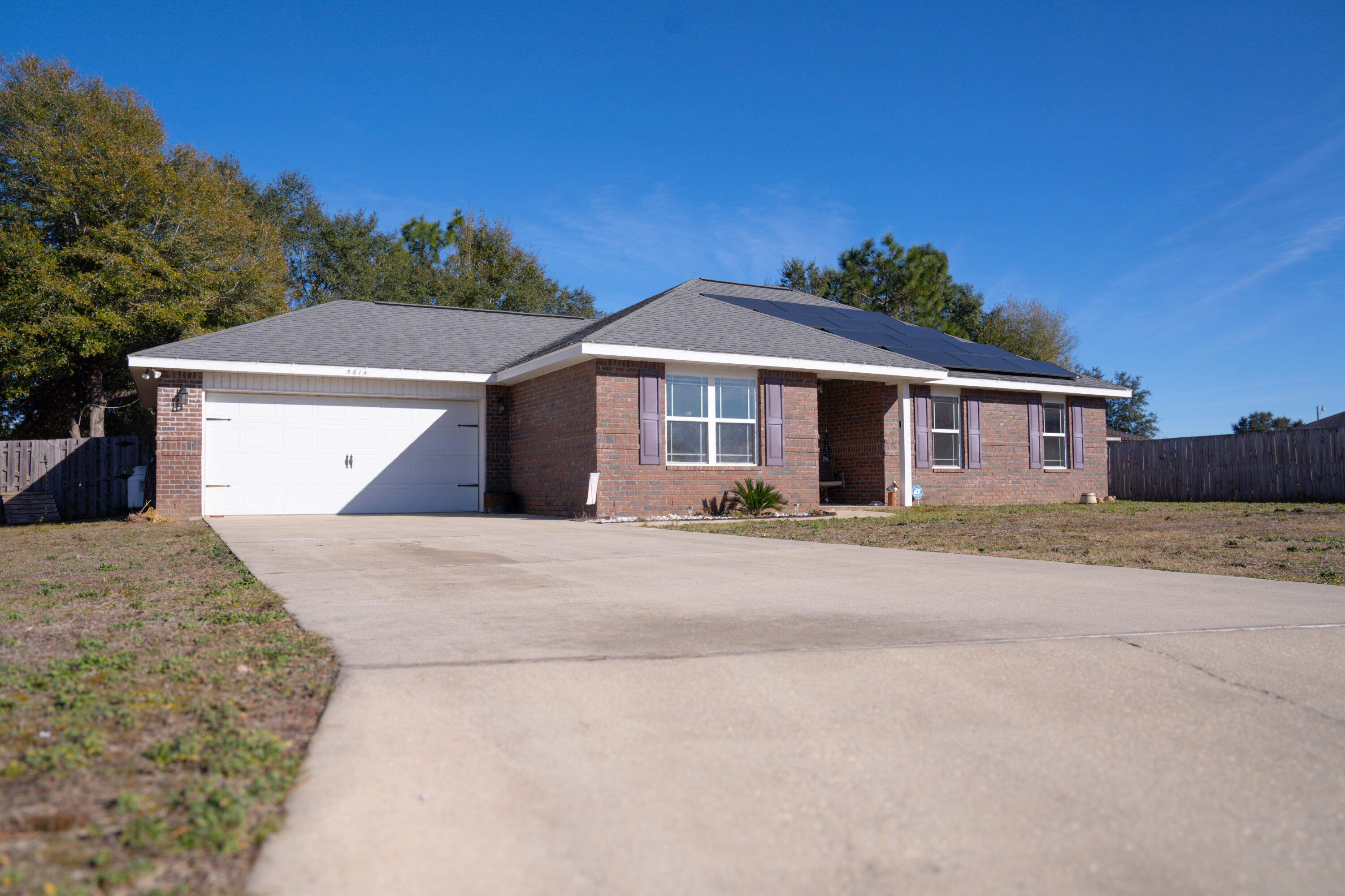 Welcome to 5614 Bellview Ct, a beautiful home in east Milton, FL. This stunning property features an open floor plan, perfect for entertaining and everyday living. Enjoy the benefits of paid-off solar panels, providing energy efficiency and significant savings on your utility bills. The spacious backyard offers a serene outdoor space to relax or host gatherings. Conveniently located close to schools, parks, and shopping, this home is an incredible opportunity for anyone looking to settle in a peaceful community. Don't miss out on this gem!