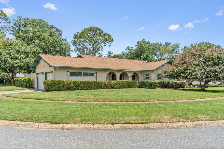 Awesome 3/2 with a heated and cooled Florida room on a corner lot in a fantastic neighborhood in the heart of Fort Walton Beach!  The remodeled kitchen has warm wood cabinets, solid surface counter tops, and sleek black appliances.  The living room has a vaulted ceiling that adds to an airy and spacious feeling.  The master suite is tucked in the back of the house for added privacy with attached redone bath which features dual sinks and a walk-in shower.  Additional features of this home include: termite bond, hurricane shutters, paved boat pad on the side of the house, 2 hot water heaters, fenced backyard, irrigation system, attached 2 car garage, yard shed with electric, and interior laundry.  Come see this great home!  Buyers to verify all information they deem important.