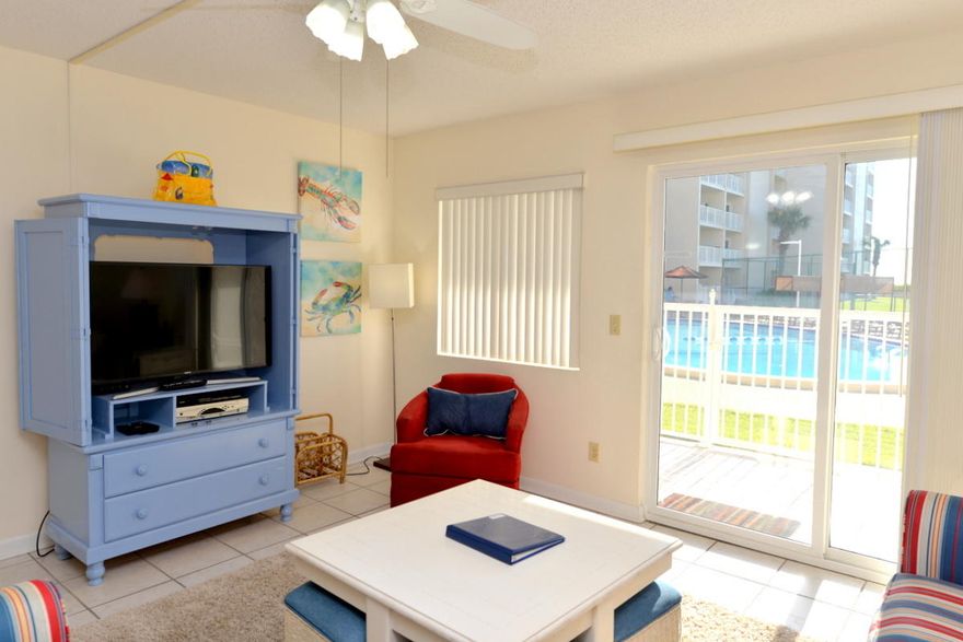 YOUR OWN LITTLE PIECE OF PARADISE! No steps, no elevators  easy living! Park in front of your front door & walk directly into your condo. From your back patio doors, walk directly to the beach. This cute one bedroom unit with ''beachy'' dcor is a great rental. Mothers love the fact that their little ones can't fall off of the balcony & older people prefer the first floor because there are no steps. This condo has tile throughout the living area with carpet only in the one bedroom. Holiday Surf & Racquet Club has undergone major exterior improvements in the last year  new paint & new tile patios as well as boardwalk restoration plus the lobby has been transformed into a well-decorated & comfortable place to arrive & or to meet friends. The complex includes many amenities such as