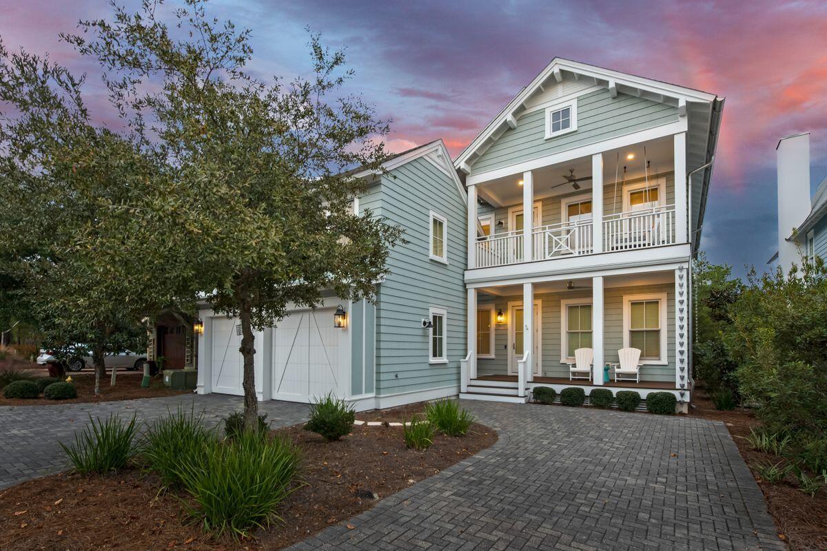 Tucked away in the exclusive Watersound Bridges community, this 5-bedroom, 7-bathroom coastal retreat blends elegant design with laid-back beachside living. Complete with a private carriage house and two-car garage, this thoughtfully crafted home offers both style and functionality just moments from the Gulf.Inside, the heart of the home is a stunning chef's kitchen outfitted with top-tier Thermador appliances, Carrera marble countertops, a spacious island, and hidden walk-in pantry. The open living area features reclaimed wood beams, a stone fireplace, and custom built-ins--creating an atmosphere that's both polished and inviting. Outdoor living is just as impressive, with generous porches in the front and back, including a screened-in area with a built-in grill and outdoor kitchen. A private splash pool with a soothing waterfall and an outdoor shower make this the ultimate space to unwind after a day at the beach.
The primary suite is a serene escape with vaulted ceilings, its own balcony, and a spa-inspired bath featuring a soaking tub, dual vanities, and a glass-enclosed shower. Each guest room is comfortably appointed with its own en suite bath and coastal design touches.
The detached carriage house offers a private haven for guests or rental potential, with a full kitchen, living area, bedroom, and balcony. Additional highlights include a full-house GENERAC generator and prime access to all that 30A has to offer.
Whether you're searching for your forever home, a luxury beach getaway, or a standout investment, this Watersound property offers timeless appeal in one of the area's most prestigious neighborhoods.