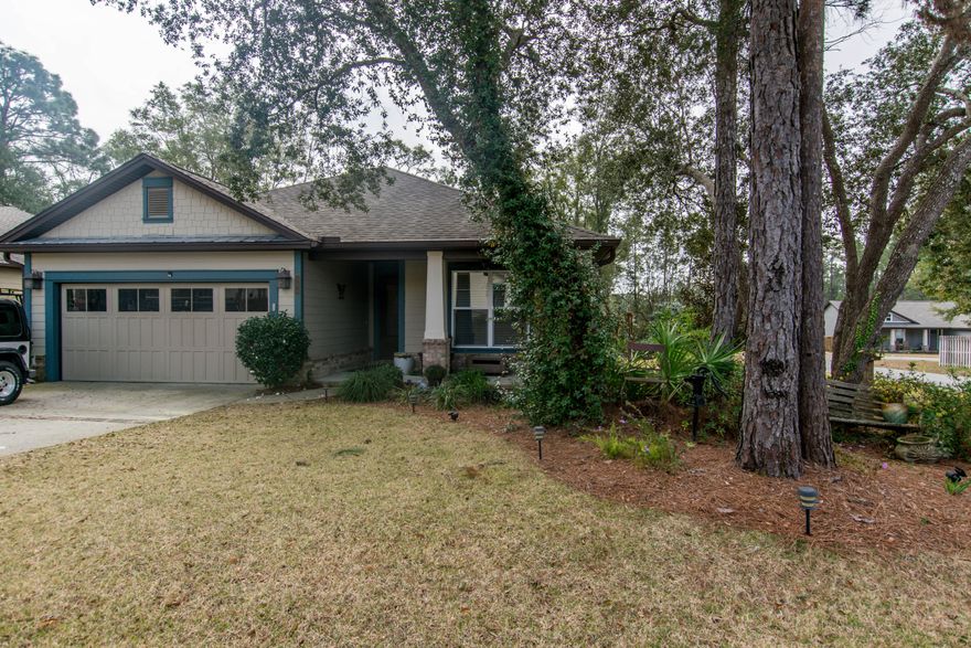 Upgraded home in the Canopies subdivision.The current owners had the home built and loaded it with upgrades. The home features tile floors throughout, Granite Countertops, Stainless Appliances, Tiled showers, 8 foot doors, 10 foot ceilings and screened in back porch. This home is very well built and has been very well maintained. The home sits on a corner lot. The Canopies also offers a community pool for owners.