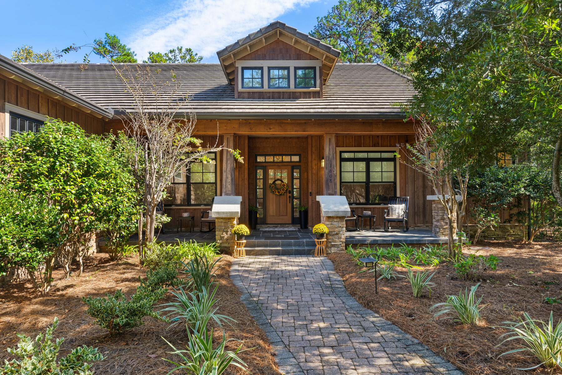 Located on one of the larger lots in the gated community of Wild Heron, this secluded home boasts a sweeping brick paver driveway, a 3-car garage and it is all canopied by beautiful trees. This custom home with a spacious split floor plan has 3 large bedrooms, 3.5 baths and a private office. The bedrooms all have en suite baths. On the exterior, check out the Mahogany front door, stacked stone columns, cedar siding, wood-clad windows, concrete roof, and slate tile porches. The custom interior upgrades were all completed in January 2022 and include: Luxury vinyl plank flooring, new kitchen cabinets with quartz countertops and marble backsplash, Designer light fixtures throughout including all new recessed LED CAN lights, new plumbing fixtures, new tankless Rinnai Hot Water, Custom designed California Closets Laundry room, Interior Paint (walls and trim), and complete Master Bathroom remodel with Jacuzzi Tub. The lengthy screened porch with natural gas grill is perfect for entertaining family and friends. The privacy of this home is simply amazing with pond views and plenty of wildlife to enjoy. This outstanding, quality home is built within a coastal sanctuary with Greg Norman golf course, tennis, 24 miles of walking/biking trails, fitness center, community pool, and boat docks with kayaks to use and explore Lake Powell, which is the largest Coastal Dune Lake in the State of Florida and North America covering almost 800 acres. Seller is a Licensed FL Realtor.