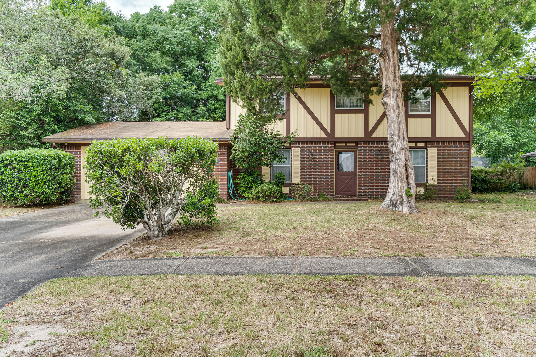 Pending under contract: Sellers accepting back up offers New Roof and Full house Rewire for the same great price. This beautiful craftsman, brick home is located in the much sought after Kenwood subdivision. With a constant breeze from the surrounding bayous, you can easily imagine yourself enjoying your morning coffee or evening night cap in the relaxing ambiance created by the charming, spacious back yard complete with beautiful mature trees and perfect set up for a garden. A 4 bedroom 2-1/2 bath house also offers a large beautifully mastered sun room with a window pass through to the kitchen providing with attached wet-bar. Also included is masterfully crafted built ins as well. With all this wonderful inside and outside don't forget the 2 car garage with built in workbenches,