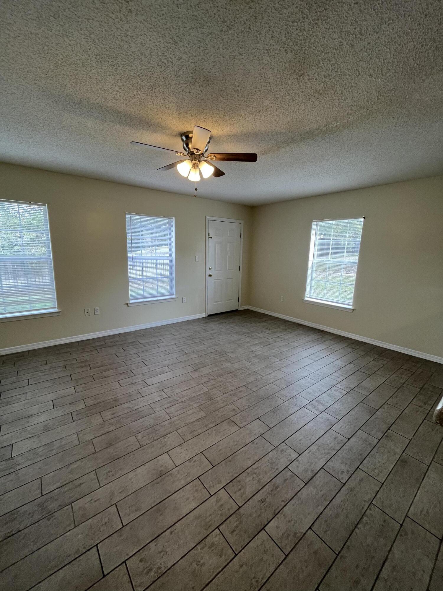 3 bedroom, 2 baths and utility area are upstairs. Master bedroom has a walk-in closet and bath vanity with dual sink. Downstairs is the spacious living/dining area. Lots of cabinets with new granite counter tops  in the fully equipped kitchen with Breakfast bar and pantry. Half bath with pedestal sink. One car garage. HOA takes care of the lawn.