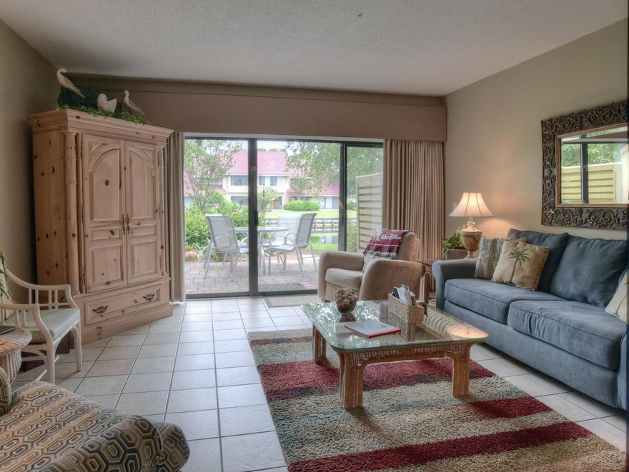 This beautiful Beachwalk villa is being sold as viewed with everything including an EZ-GO Golf Cart. It is ready to rent and less than a block from the beach. It has a wonderful lake view and has been updated in the kitchen with new stainless appliances. The furniture and housewares all convey. Please call to view as it is constantly rented.