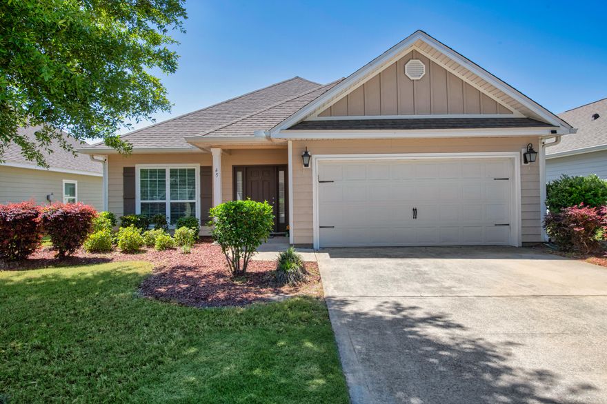 Beautifully placed within the community of Hammock Bay, this home welcomes you with the ambient environment of the open-concept space that leads to the backyard. The yard itself features aluminum fencing with a captivating view of the pond alongside a wooded area behind that adds even more to the intimate and serene touch this home offers. Inside the 3 bed 2 bath home lies beautifully pre-engineered wood flooring, stainless steel appliances, tiled bathrooms, granite countertops in the kitchen and bathrooms, the master bath including a double vanity, crown molding throughout the living/dining/kitchen/office, a coffered ceiling, and a tiled laundry room that leads to the two car garage with access to the roomy attic space.  The Electric Fireplace DOES  NOT CONVEY.  Buyer(s) are responsible to personally verify all details for property and dimensions. Any information contained in this listing is believed to be accurate but is not guaranteed.