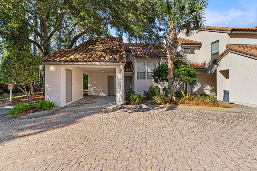 Beautiful 2 bedroom, 2 bath lake front condo located in the sought after Tennis Village in Tops'l Beach Resort. Inside you will find a 1,525 square foot open floor plan, with tile flooring throughout living areas and bathrooms. The family room has dramatic cathedral ceilings adjacent to the dining room that opens to the kitchen and breakfast bar. The first floor also contains a guest room with double vanity bathroom, as well as access to the outside patio and dock. Upstairs you'll discover a generous primary bedroom with an ensuite bath with double vanities, jetted tub and separate shower, along with a lock-off loft area featuring custom bunk beds and private balcony overlooking the lake. This dynamic property can serve as a vacation home and income producer with annual revenue projections up to $40,000 with updates. Tops'l Beach Resort offers first-class amenities that include 600 feet of beach frontage, a fitness club with 14 tennis courts, on-site tennis pros, racquetball, aerobics, on-site massage therapy, swimming pools, steam and sauna rooms, a whirlpool, gated entry, security as well as an on-site bar and restaurant.