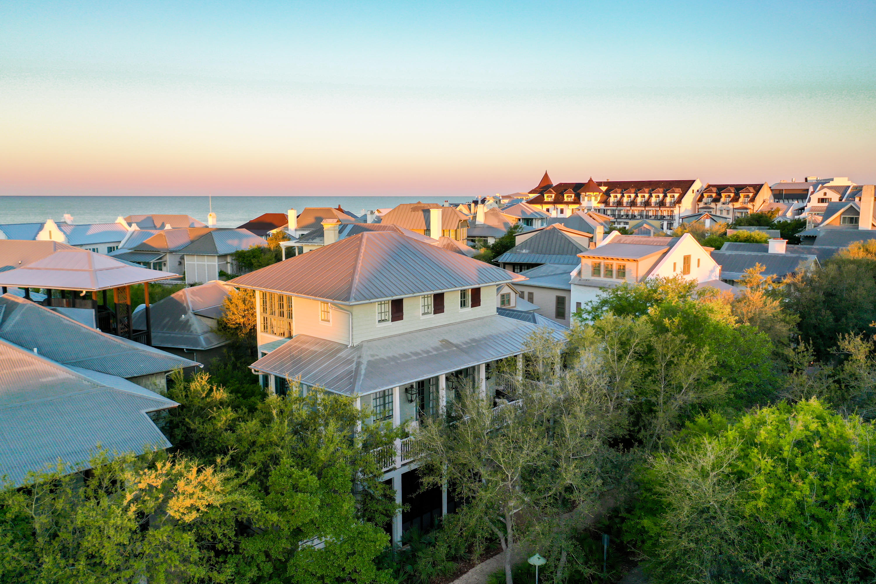 This beautifully renovated and updated Rosemary Beach gem is offered complete with designer furnishings. Lower level boasts a bedroom with ensuite bathroom and access to the front porch with swing and sitting area. There is a second large bedroom with a sitting area and access to the expansive courtyard. Also on the lower level, a second full bath, and a charming nook with a single bed.The main living area is found on the stunning second level with soaring ceilings and floor to ceiling windows for picturesque views of the gulf. A gourmet kitchen with stainless Thermador appliances and a spacious elegantly appointed living area are perfect for entertaining and relaxation. A full bath with a stacking laundry unit area is also found on the second level.