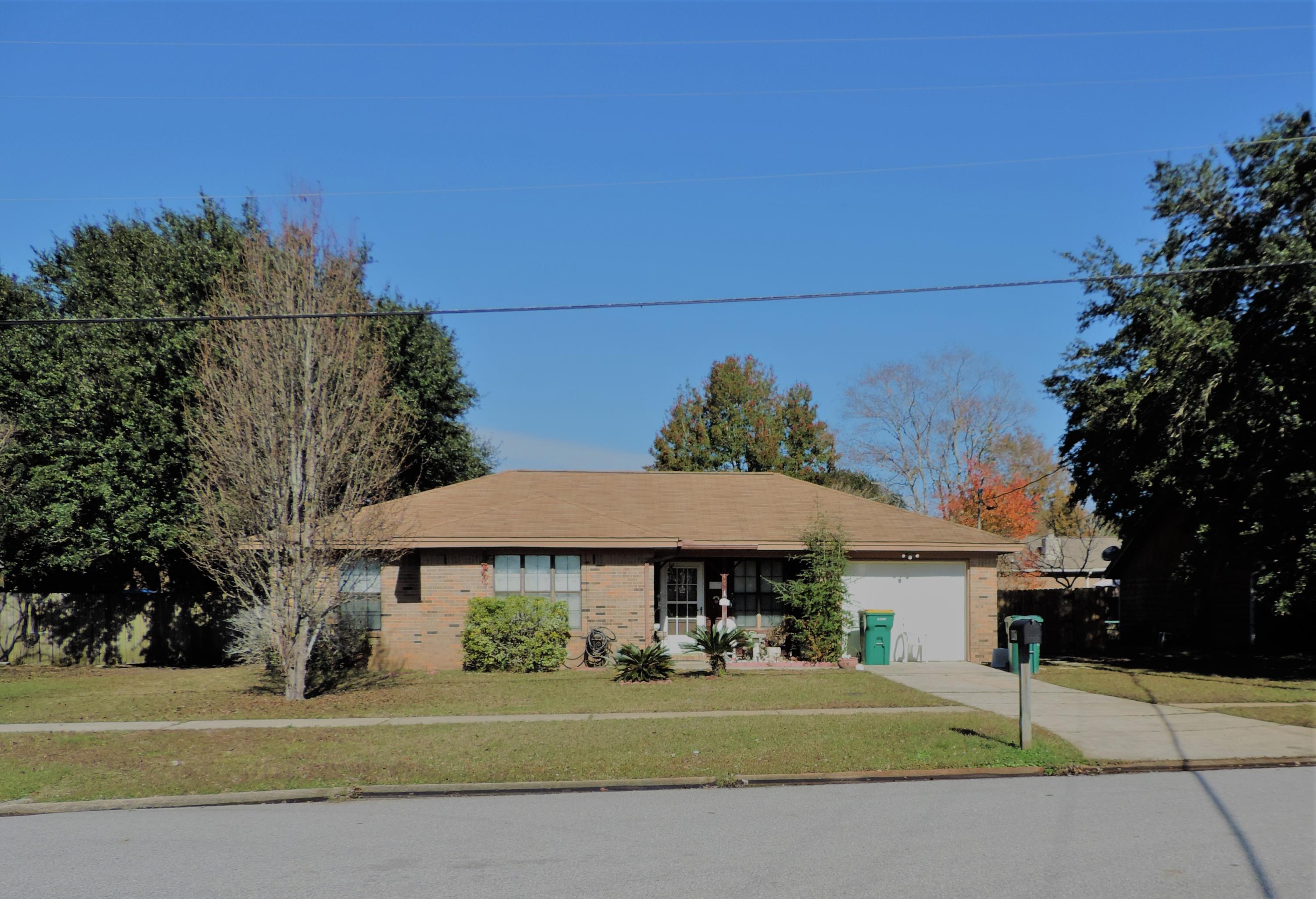 Great starter or empty nester home. Open floor plan- kitchen dining andliving area. Sliding glass doors to large covered patio with wooden deck outside the kitchen area. Galley kitchen leads to the inside laundry room. Large shower in the master bath room. Large privacy fenced backyard with 2 utility sheds, one for lawn care tools and another for storage. AC is only 1 year old.