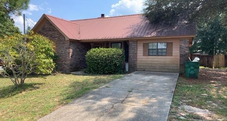 This REO home is located in the established area of Country View and just minutes from I10 access, shopping, and a short drive to Duke and Eglin AFB alike. Home needs repairs and therefore will not qualify for most financing. This 3 bedroom 2 bath split bedroom design home has brick exterior with metal roof, privacy fenced back yard, several storage buildings (one which houses pool equipment) and the remains of an in ground pool It is unclear if this pool is salvageable. Home has brick fireplace, galley style kitchen, indoor laundry and a bonus room off of the laundry room that could either be used as a 4th bedroom or an office. Seller's asking price is $109900 .