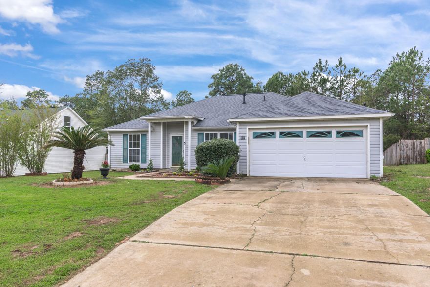 *Virtual tour available*New roof and newly updated four-bedroom, two-bathroom home is a must see! New gray wood-look laminate flooring and fresh paint have been updated throughout the entire home.Step inside the foyer from the front door and the living room is directly ahead. You will immediately notice the high ceilings and fireplace at the focal point of the living room. Directly to your left is a hallway with a linen closet, two bedrooms and a hall bath with a tub / shower combo.