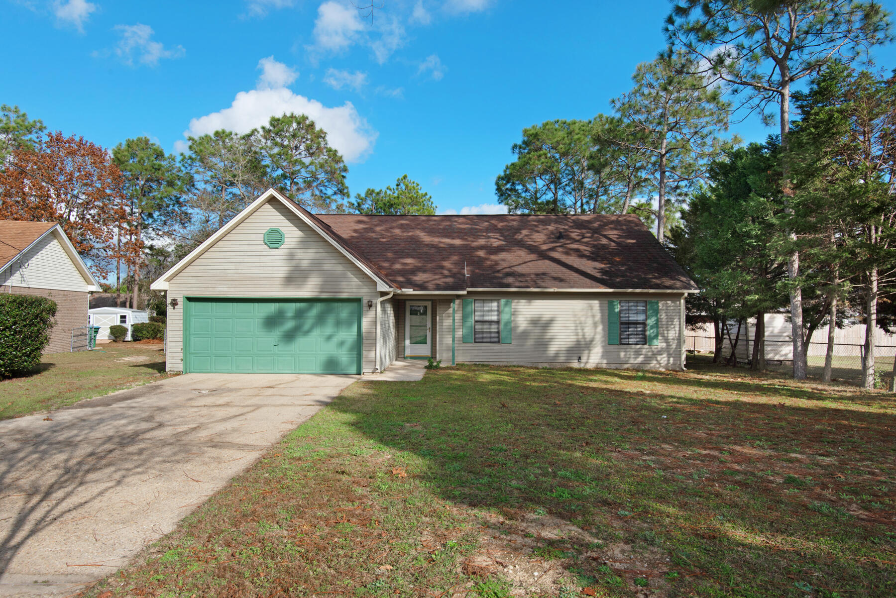 Check out this piece of mind home for todays fast pace living. Located South of I-10 with new AC and Hot Water Heater. Living room features cathedral ceilings and skylights; bright and airy. All bedrooms and bathrooms conveniently located downstairs. Kitchen offers plenty of room with stainless appliances and granite counter tops. This country kitchen offers lots of natural light and custom painted cabinets and a nice eat in breakfast area. Upstairs you will find a bonus room that could easily be used as an office/gym/kids play room, etc. Back yard is fully fenced and very large with additional storage building. This one will challenge all comparable properties in the area for value. Sellers are also offering as a bonus $5,000 flooring allowance for buyer to use as you choose.
