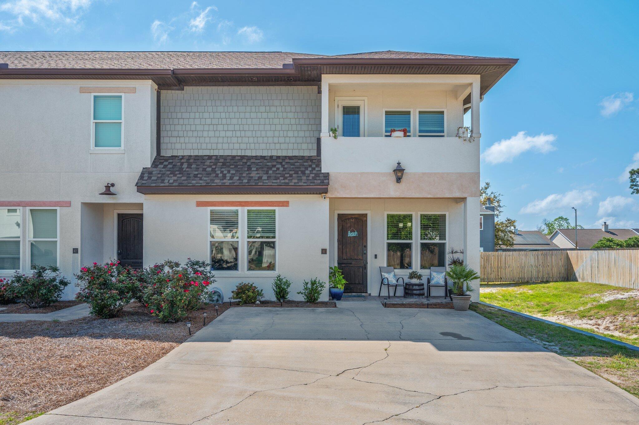 Welcome to Destin Oaks! 4 bedroom and 4 full bath is an end unit with largest driveway in the community, to accommodate 6 vehicles. The home offers 2,279 square feet of living space, located in heart of Destin. Minutes from shopping and dining, offering a lifestyle of convenience and luxury. Easy commute to Eglin and Hurlburt. Up and downstairs Master Suites! Granite counter tops throughout. Walk in Master Shower and Separate Tub upstairs. Upstairs Master has private balcony. Two additional bedrooms located upstairs. These rooms are large enough for king-sized beds and share a Jack-and-Jill bathroom. Walk in Closets in ALL bedrooms. Stainless Steel Appliances, including a smart refrigerator. High Impact Windows. A private patio out back. Community Pool!