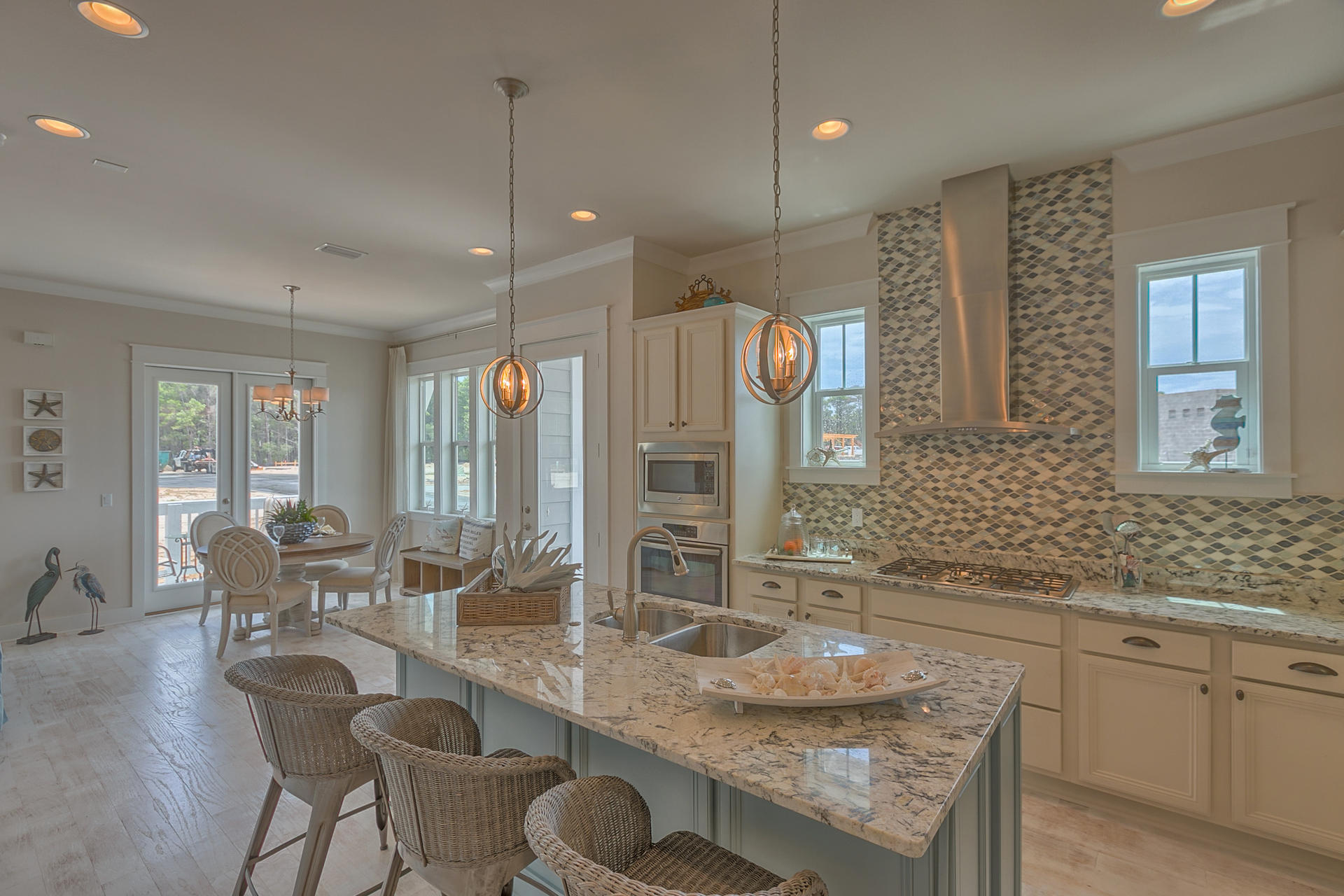 The Cozumel Triplex Townhome floor plan is uniquely designed to feature 3 bedrooms and 2.5 bathrooms with a 2 car garage. Home features include 10ft Ceilings, hardwood floors, granite countertops, and stainless steel appliances to name a few. The Town of Prominence is located on HWY 30A between Seagrove and Alys Beach. Residents will enjoy easy access to a beautiful Town Center, Resort style pools, Fitness Center and Private Shuttle Service to the beaches of 30A. ''The Hub, the community's town center includes restaurants, shops, and an amphitheater with covered event pavilion, a cinema screen for movies as well as a stage for concerts and events.