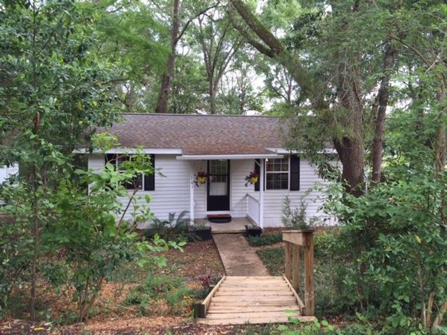 WHY RENT?? Check our this adorable 1947 Florida Cottage that you can BUY for less than you could RENT! This beautiful home has been lovingly cared for since 2007 by an owner-occupant, but a job transfer has caused them to make a move. Perfect for an avid golfer, this home abuts the 12th green at the Eglin golf Course. Don't let the age fool you. The drywall and windows were replaced in 2003, the roof was replaced in 2009 with an architectural style shingle roof, the bathroom was remodeled in 2010 including resurfacing the cast-iron tub and a new 14.5 SEER HVAC system was installed in March of 2013. A large screen porch adds a ton of outdoor living space to the home and the back yard has been divided with one side featuring a sitting area and fire pit. Quit RENTING. Call TODAY!