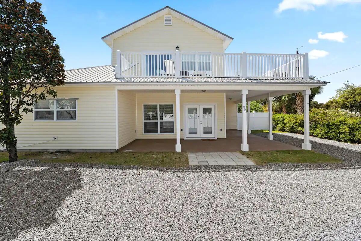 INVESTORS, TAKE NOTE: 100% bonus depreciation eligible with a cost segregation study! Consult your CPA for details and requirements. This is a PROVEN INCOME-PRODUCING PROPERTY! WHY YOU WILL LOVE 360 S HOLIDAY ROAD - YOUR HOLIDAY HAVEN: INTERIOR FEATURES
-- Open concept first floor with spacious living and dining area
-- Modern kitchen with ample counter space and seating
-- First-floor laundry room
-- First floor includes two king bedrooms and one full bathroom with shower
-- Second floor includes one king bedroom, one queen bedroom, and one full bathroom
-- Unique bunk space with two full-over-full bunk beds
-- Second floor features wraparound deck access from sliding doors
-- Fresh, fun, modern interior design throughout
EXTERIOR FEATURES
-- Just 300 feet from beach access at Holiday Rd Gate
-- Fully fenced, private backyard
-- Stock tank-style filtered pool
-- Hot tub
-- Fire pit with seating area
-- 100'' outdoor movie screen and backyard theater setup
-- Large, sunny deck perfect for entertaining or relaxing
-- Cozy Adirondack chairs on wraparound upper deck
-- Parking for 3 vehicles (depending on size)
-- No HOA - bring your boat, trailer, or RV and park on property