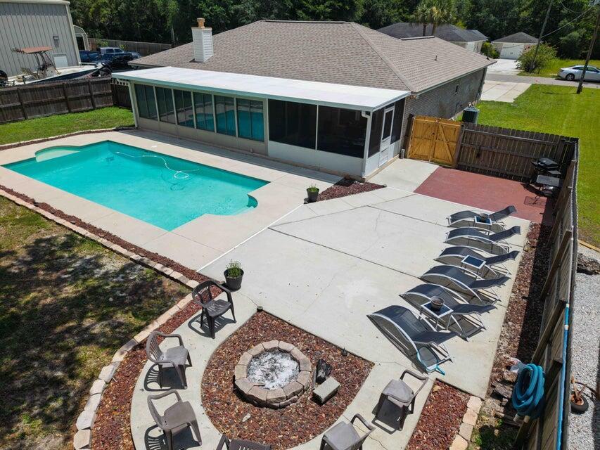 3147 Hickory - This home delivers the ultimate Florida lifestyle. Dive into your private pool, gather around the custom stone fire pit, and enjoy a sprawling fenced backyard built for entertaining. Total privacy, plenty of space, and endless potential for fun or relaxation. Located just minutes from a public dock, stunning white-sand beaches, and some of Navarre's best restaurants. With an easy commute to Pensacola, Destin, and bases across Northwest Florida, this home blends resort-style living with real-world convenience. Sunsets, beach days, and unforgettable nights start here--don't let it get away.
