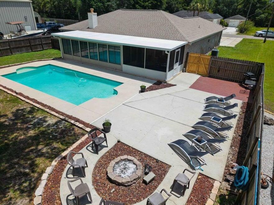 3147 Hickory -  This home delivers the ultimate Florida lifestyle. Dive into your private pool, gather around the custom stone fire pit, and enjoy a sprawling fenced backyard built for entertaining. Total privacy, plenty of space, and endless potential for fun or relaxation. Located just minutes from a public dock, stunning white-sand beaches, and some of Navarre's best restaurants. With an easy commute to Pensacola, Destin, and bases across Northwest Florida, this home blends resort-style living with real-world convenience. Sunsets, beach days, and unforgettable nights start here--don't let it get away.