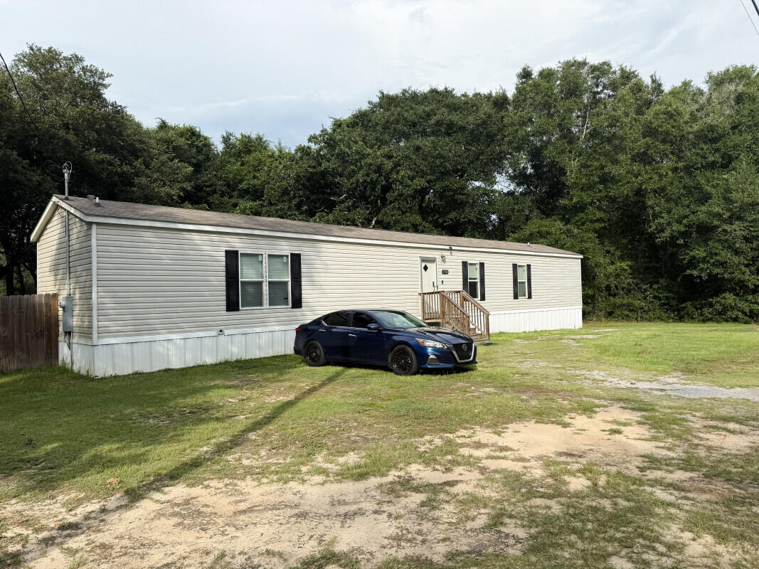 This 3-bedroom, 2-bathroom mobile home, built in 2018, offers comfortable and affordable living in peaceful DeFuniak Springs. Situated on a spacious 0.45-acre lot, there's plenty of room to enjoy outdoor activities, start a garden, or simply relax in your own private space.Inside, you'll find a functional and open layout with a welcoming living area, a roomy kitchen with ample cabinet space, and a split-bedroom floor plan for added privacy. The primary suite includes a full bath and walk-in closet, while the two additional bedrooms share a second full bathroom.Whether you're looking for a starter home, downsizing, or investing, this property is move-in ready and full of potential!