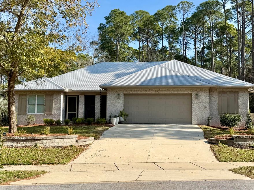 Exquisite 3BR/2BA Randy Wise custom built home - No HOA! Catch glimpses of the bay from this all brick home on a private 0.59 acre lot with two screened porches. Thoughtfully designed single story split-bedroom floor plan features quartz countertops, crown molding, custom shades, and smart upgrades, including a floor outlet in living room, and pre-wiring for security and entertainment. Step into serenity - the primary suite feels like a spa with heated tile floors, a Kohler soaker tub framed by a picture window and an electric fireplace. The master bath also features a spacious step in shower, water closet with bidet, walk in closet and laundry room. Entertain in style in the open-concept kitchen and living area that boasts a new custom built in entertainment center. Offered furnished! The oversized 2.5-car garage features a dedicated workspace area and pull-down stairs leading to the attic which offers more storage with lighting, flooring, and shelving. Step outside to the expansive back yard that backs up to a conservation easement, enhanced with bistro lighting, a lighted fountain, 3-person hot tub, and citrus trees.
