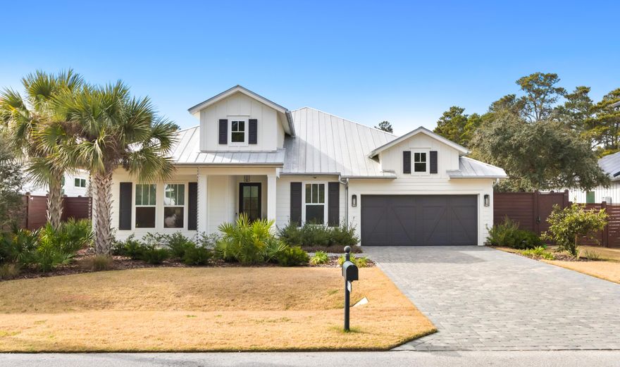 Stunning Seacrest Beach retreat on a quiet dead-end street with no HOA, just a short walk to the beach and in close proximity to Alys Beach, Rosemary Beach, WaterSound Beach Club, and Camp Creek Golf Course. Designed by Bunny Hall of The Perfect Plan and remodeled by Armbruster Construction this 4-bedroom, 4.5-bath home showcases designer lighting by Beautiful Lights, custom tile from Q Tile, custom window treatments by Beach Blinds and offers 2,528 square feet of thoughtfully designed living space with a 2-car garage, a paver driveway, and a large fenced back yard with a private pool. A grand entry welcomes you into an open-concept floor plan showcasing custom designer lighting, tile, and finishes throughout. The living area features a tray coffered ceiling and custom wallpaper, flowing seamlessly into the dining area with a well-appointed dry bar including a large wine refrigerator and ice maker. The chef's kitchen has been fully renovated with marble countertops, a large island, pantry, high-end stainless appliances, gas cooktop, in-wall oven and convection oven, dishwasher, and an oversized single-basin stainless sink, ideal for both everyday living and entertaining. The primary suite overlooks the private pool and fenced backyard and offers a spa-like bathroom with dual vanities, a private water closet, walk-in shower, and walk-in closet. Indoor living extends outdoors to a screened porch with a gas fireplace and summer kitchen, perfect for year-round enjoyment. The spacious backyard includes a salt water pool with waterfall features, chair deck with umbrella designed and installed by Southern Blue, an outdoor shower, and plenty of room to relax or entertain in the large fenced back yard. This property is a must see, call to schedule a showing today.