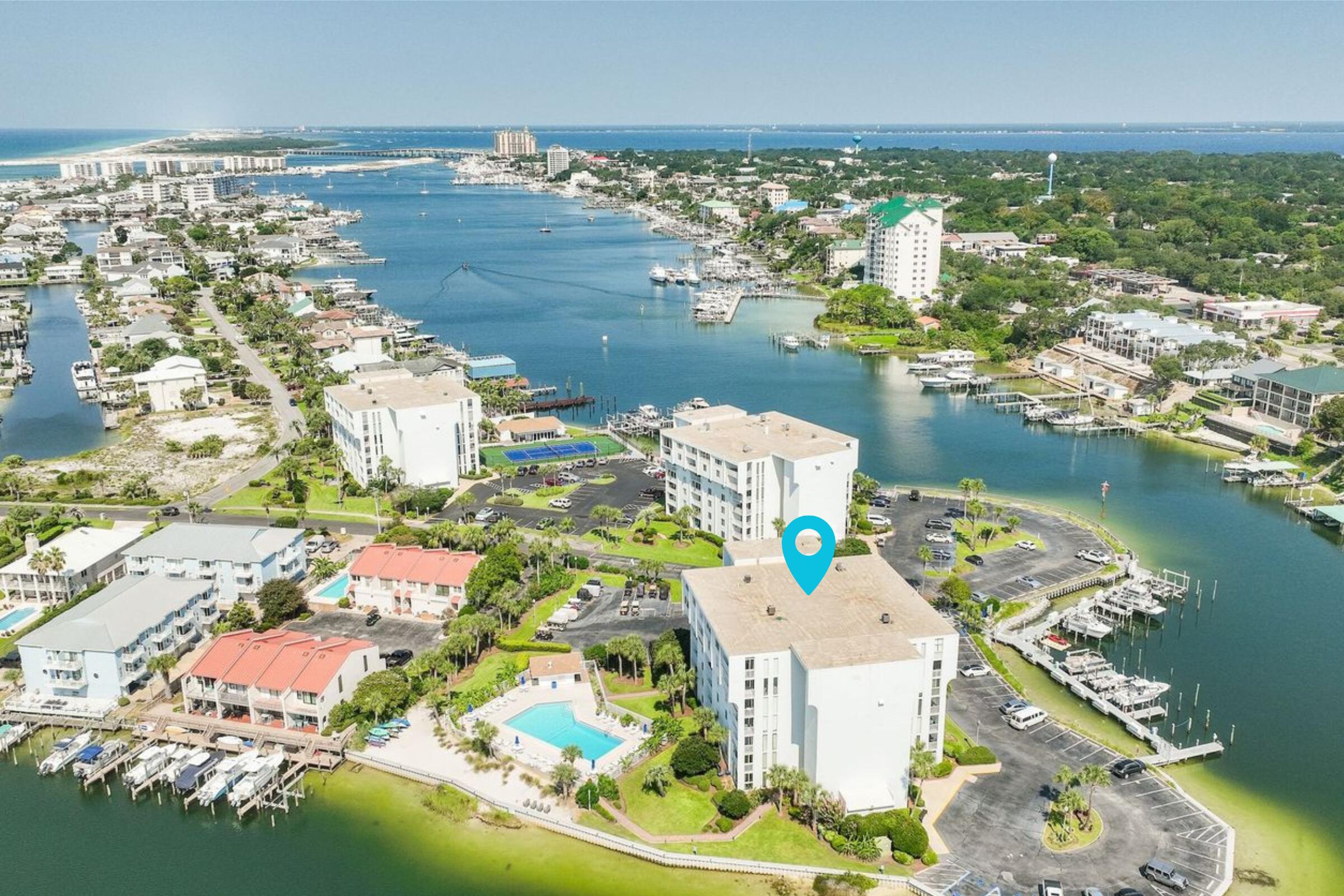 Experience the Best of Boating & Beachside living at Dolphin Point Condo where harbor waterfront serenity meets exclusive beach access featuring an array of amenities and access to the best of both worlds! Just minutes away from the private deeded beach and overlooking the picturesque harbor. Immerse yourself in this meticulously updated and completely furnished 2-bedroom, 2-bathroom waterfront oasis. Dolphin Point is one of Destin's best kept secrets as a boater's paradise and is located on Holiday Isle, away from Destin's traffic and the summer crowds. You are never landlocked at Dolphin Point...just a water boat taxi ride to all of the restaurants, shops and attractions to HarborWallk Village. Amenities include private gated beach access, large heated pool, private waterfront clubhouse, marina, pickleball & tennis courts, paddle board/kayak launch, storage, BQ grilling area, golf cart parking, & more! Dolphin Point features a Marina with boat slips (for potential purchase or rent) Onsite Mgmt. & Maintenance, 24 Hr. Surveillance Camera and soon Dolphin Point Condo will be a gated waterfront community providing additional privacy. Whether you are looking for an investment property, second home or permanent residence, this waterfront oasis checks every box!